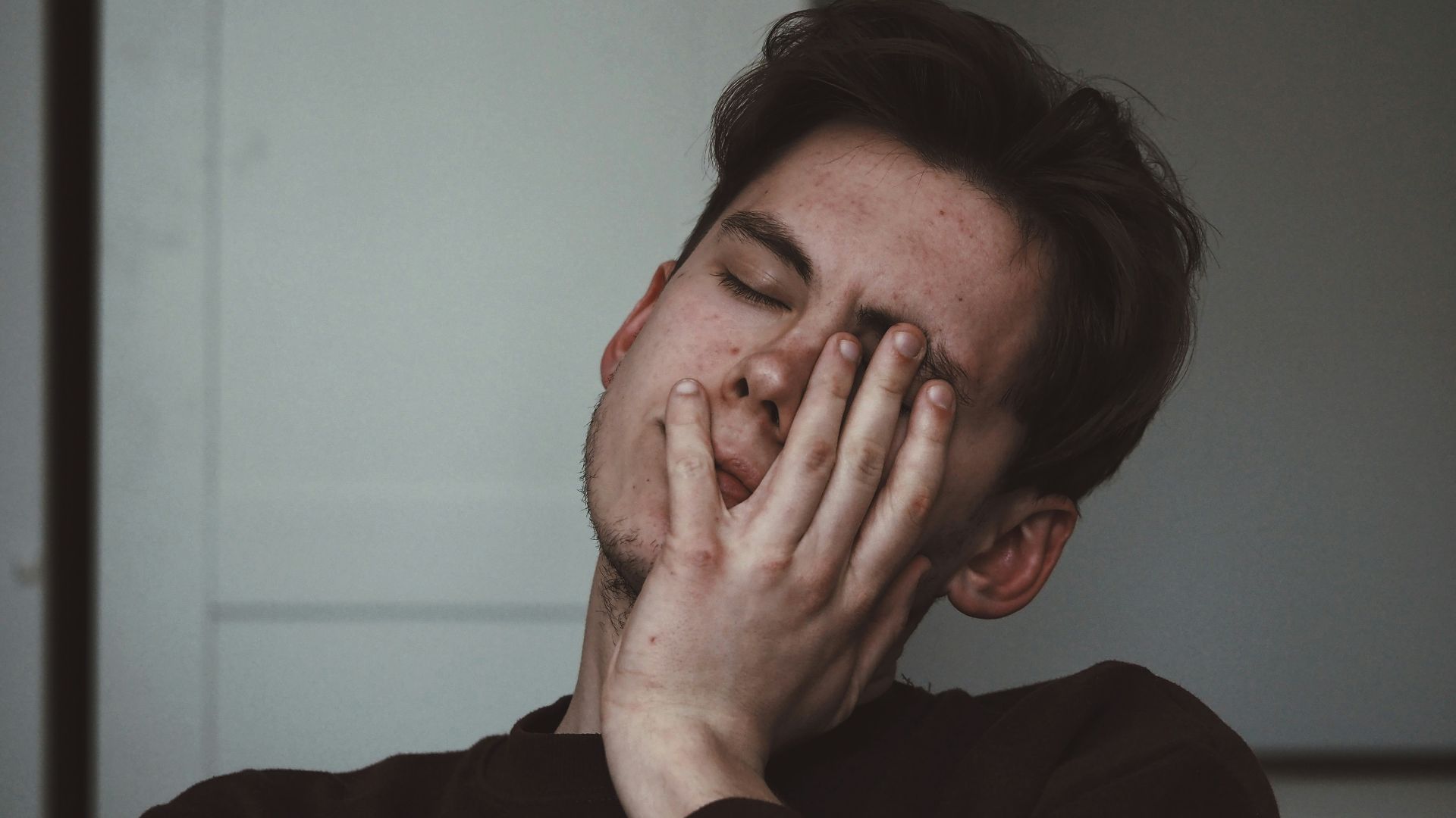 man wearing black crew-neck top