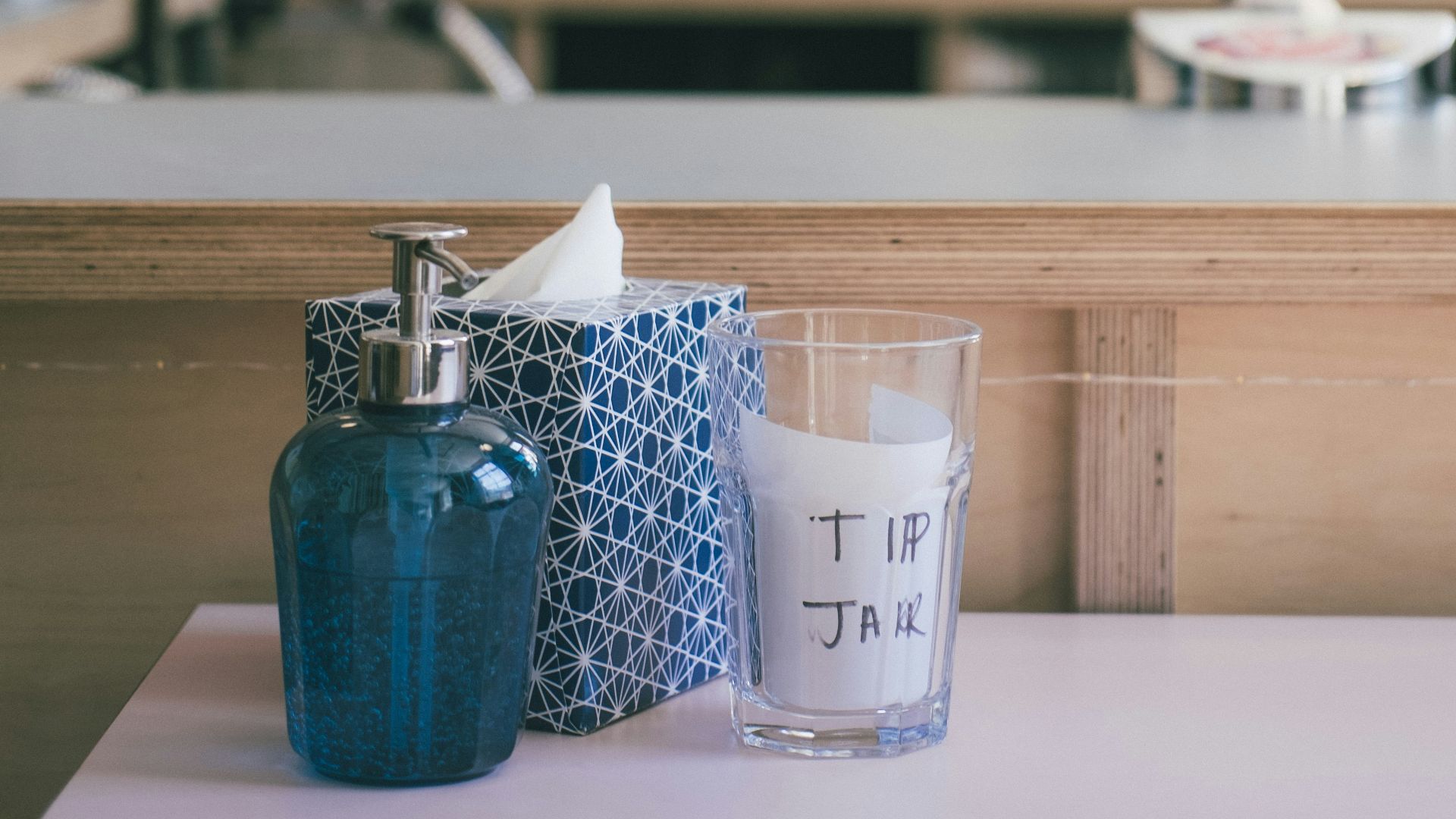 blue ceramic mug on brown wooden table