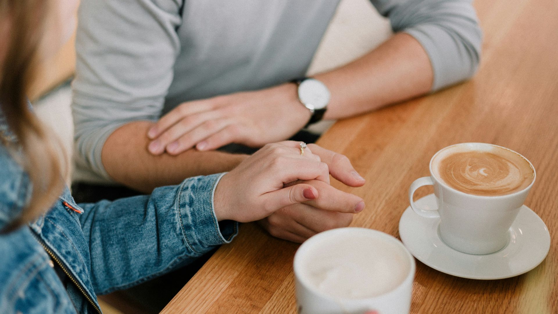 man and woman holding hands