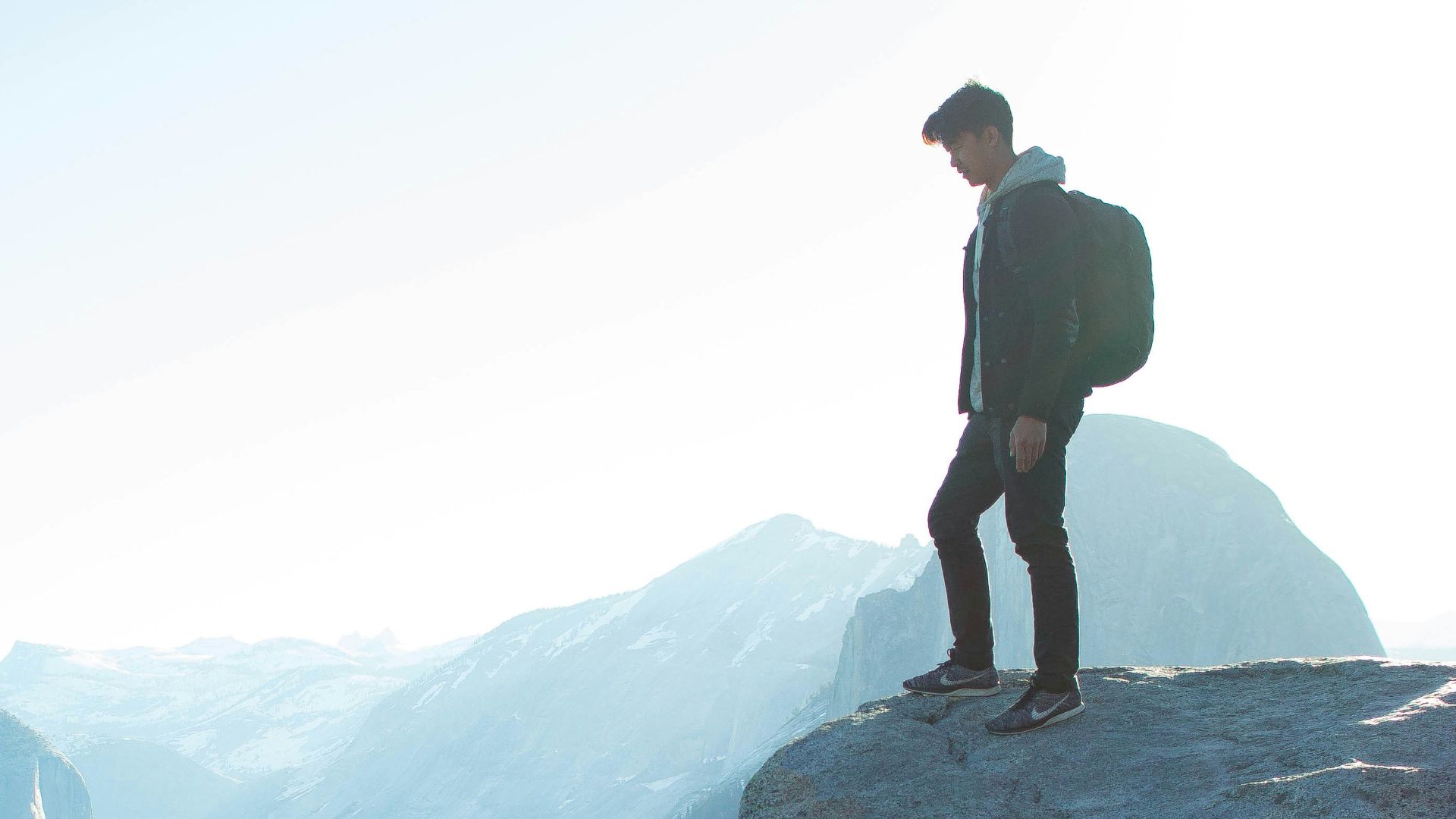 man standing on cliff