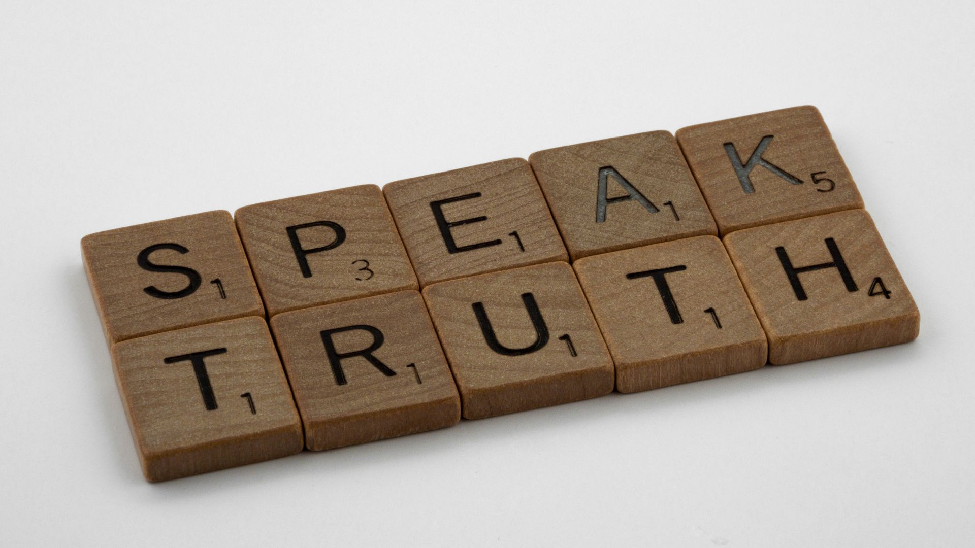brown wooden blocks on white table