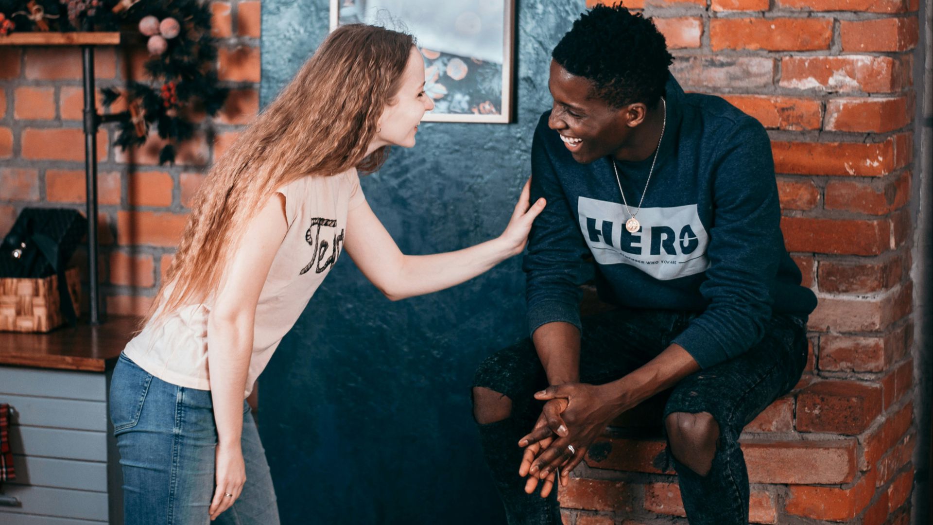 man and woman standing near wall