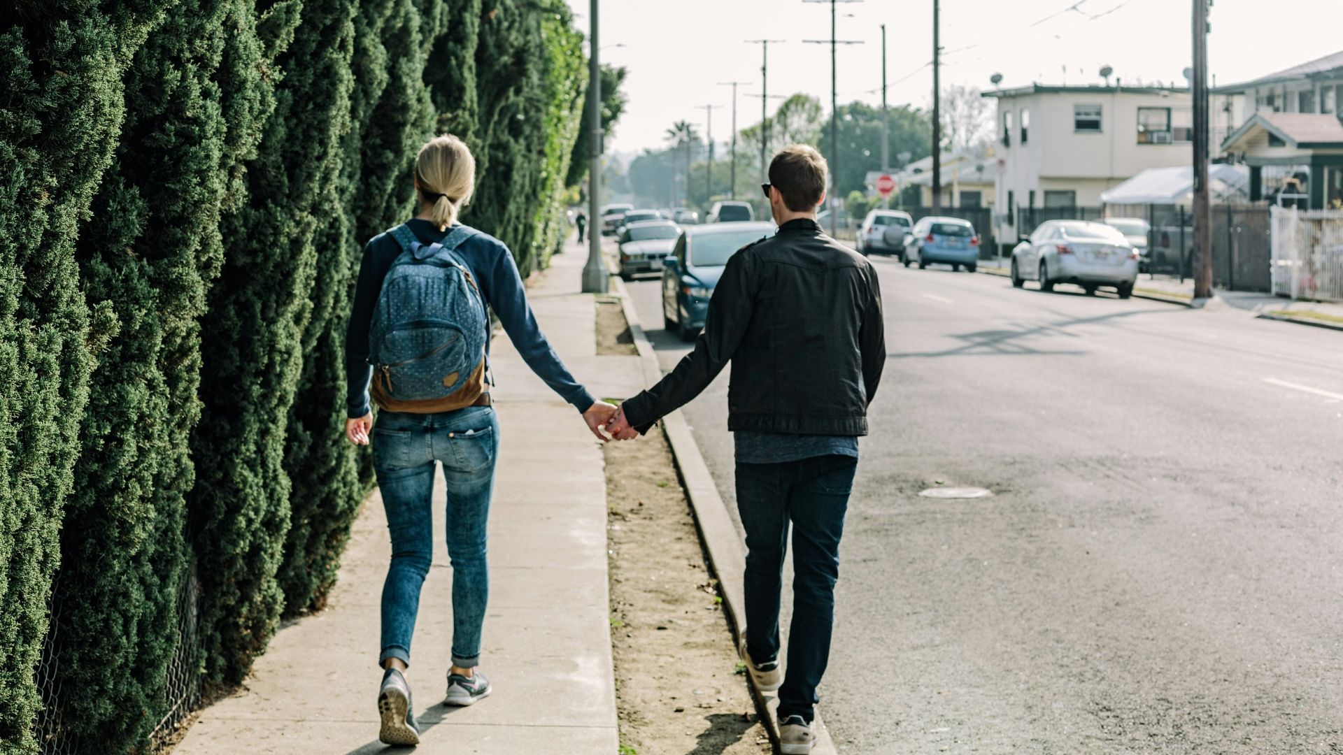 man and woman walking on pathway during daytime