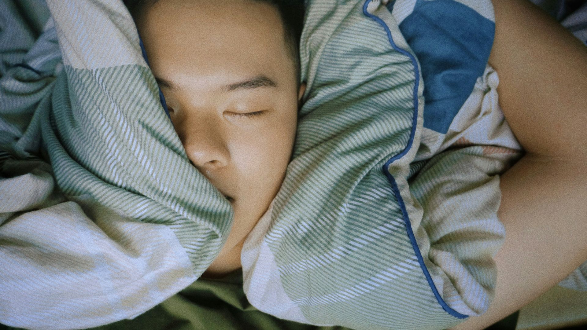 baby in blue and white stripe onesie