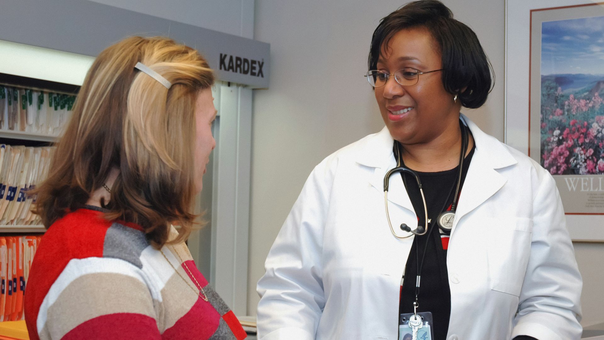 woman in white button up long sleeve shirt holding white card
