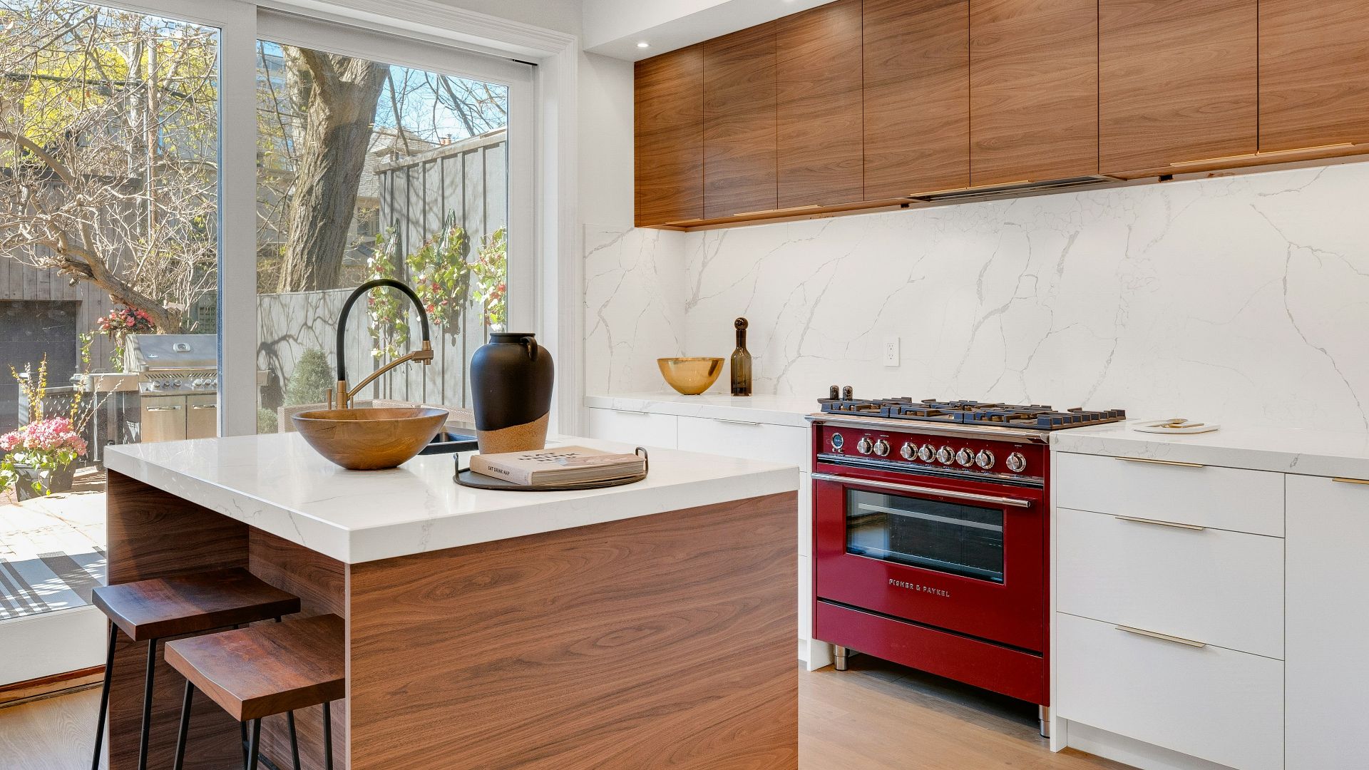 kitchen island near gas range beside base cabinets