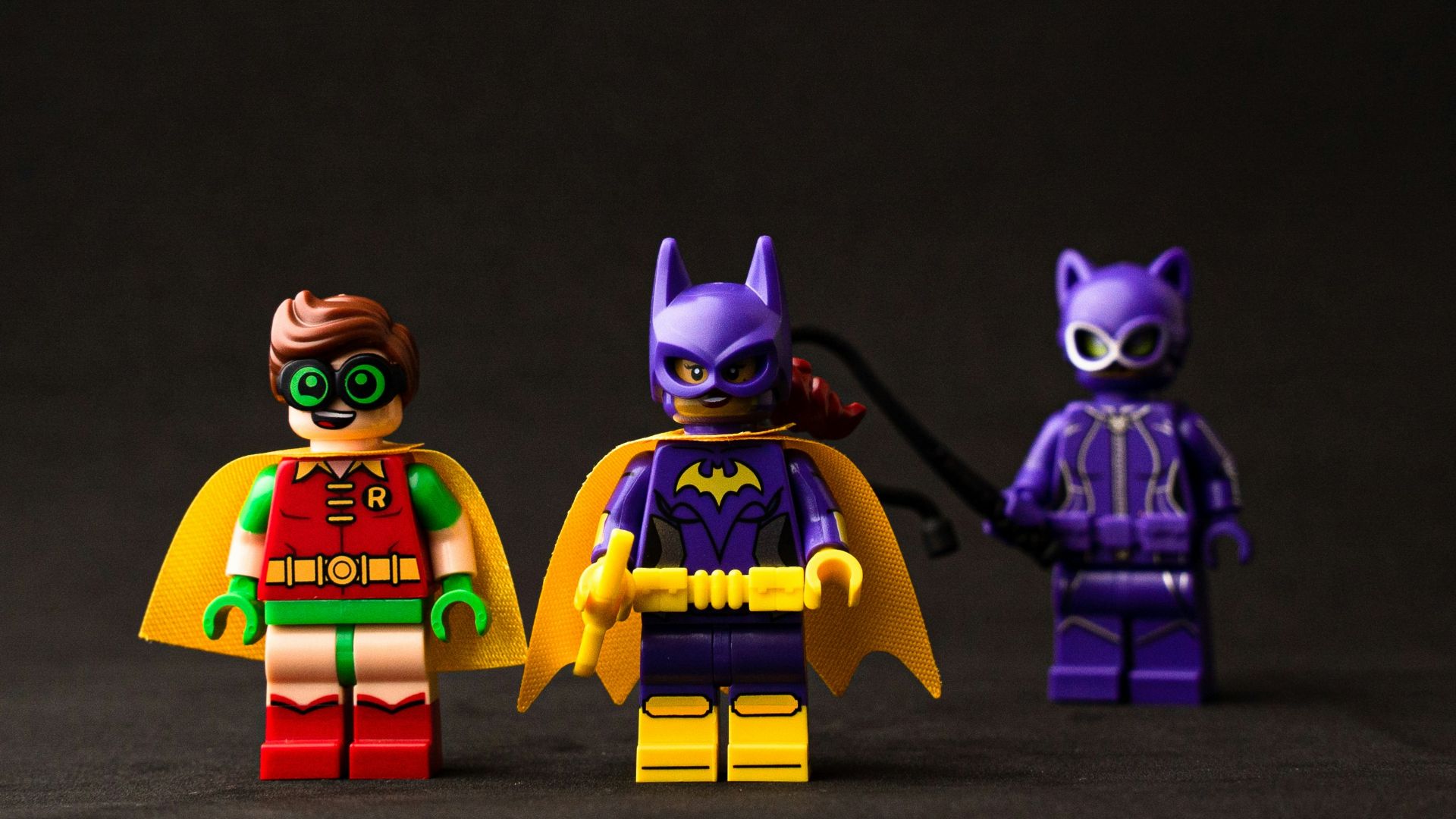 two yellow and purple robot toys