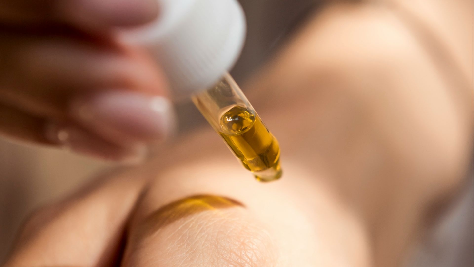 person holding dropper