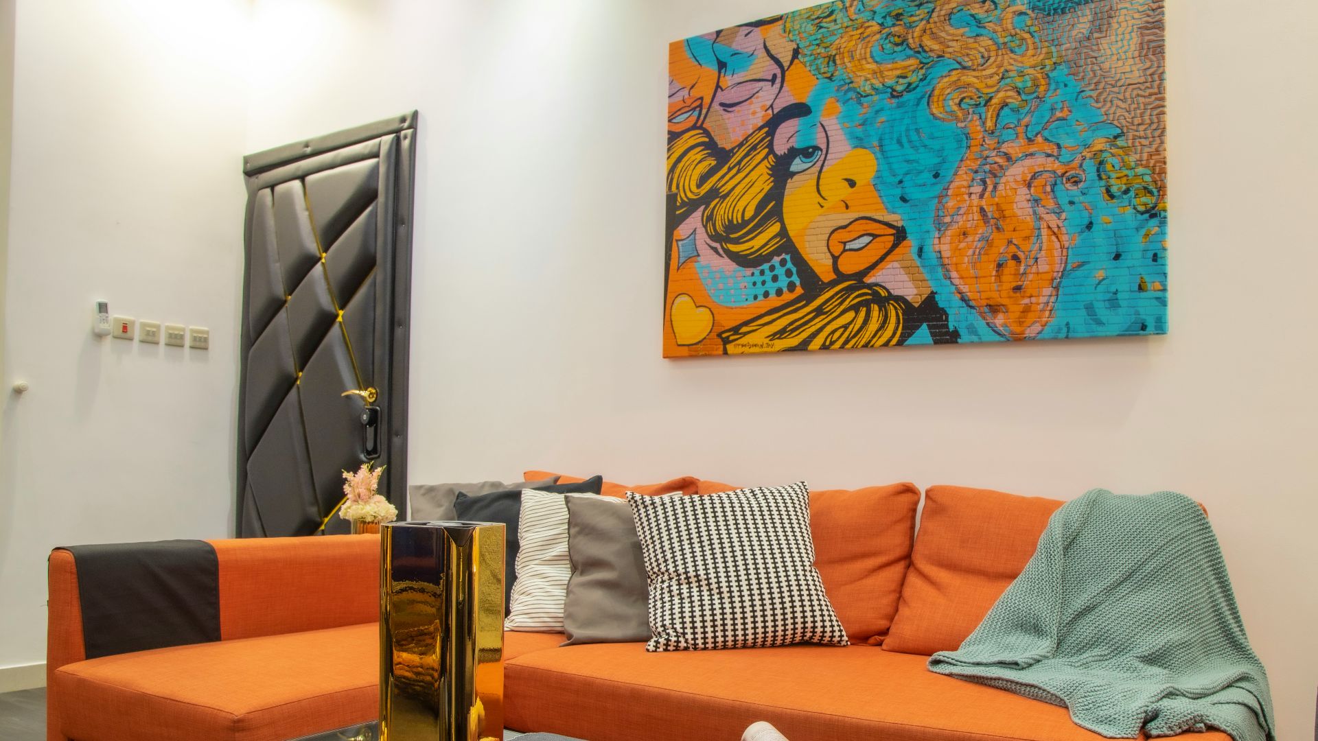 brown wooden drawer beside blue and white floral wall