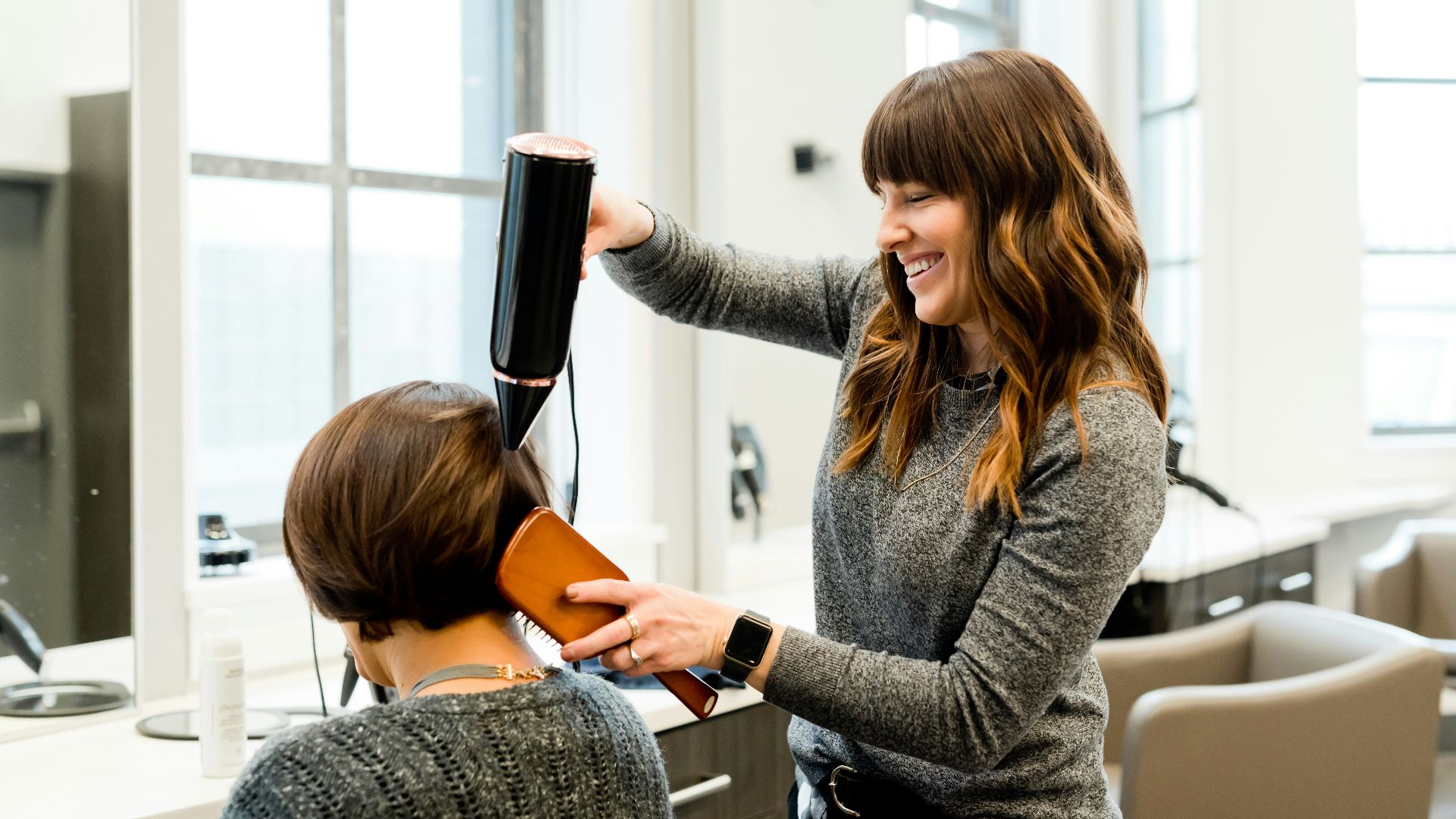 woman holding hair dryer
