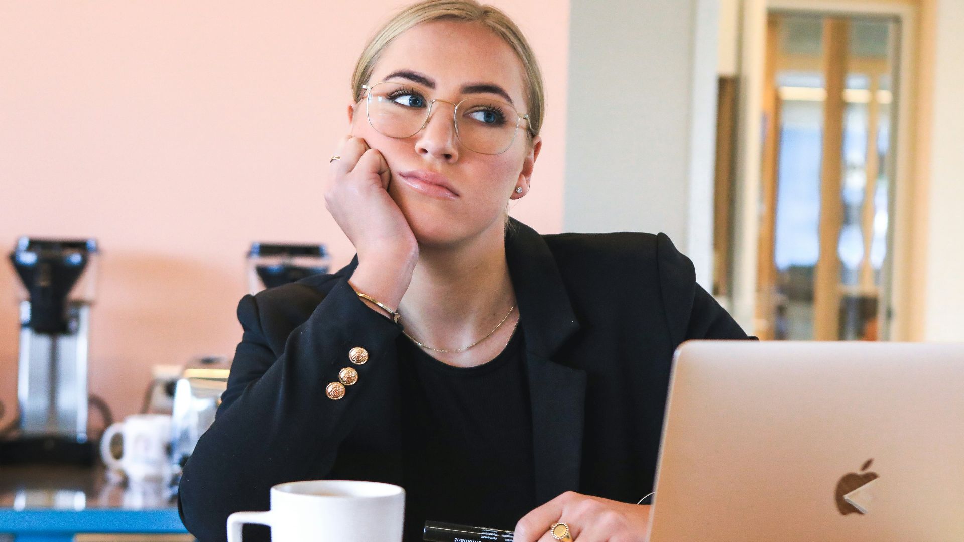 woman in black long sleeve shirt using macbook