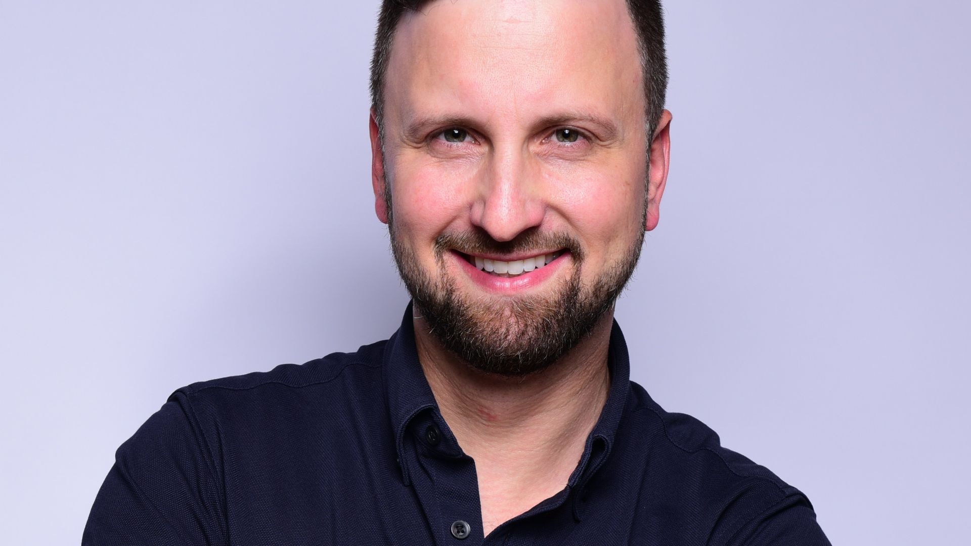 man in black dress shirt wearing black apple watch