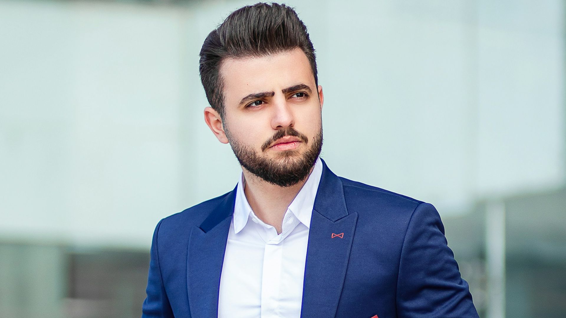 man in blue suit standing