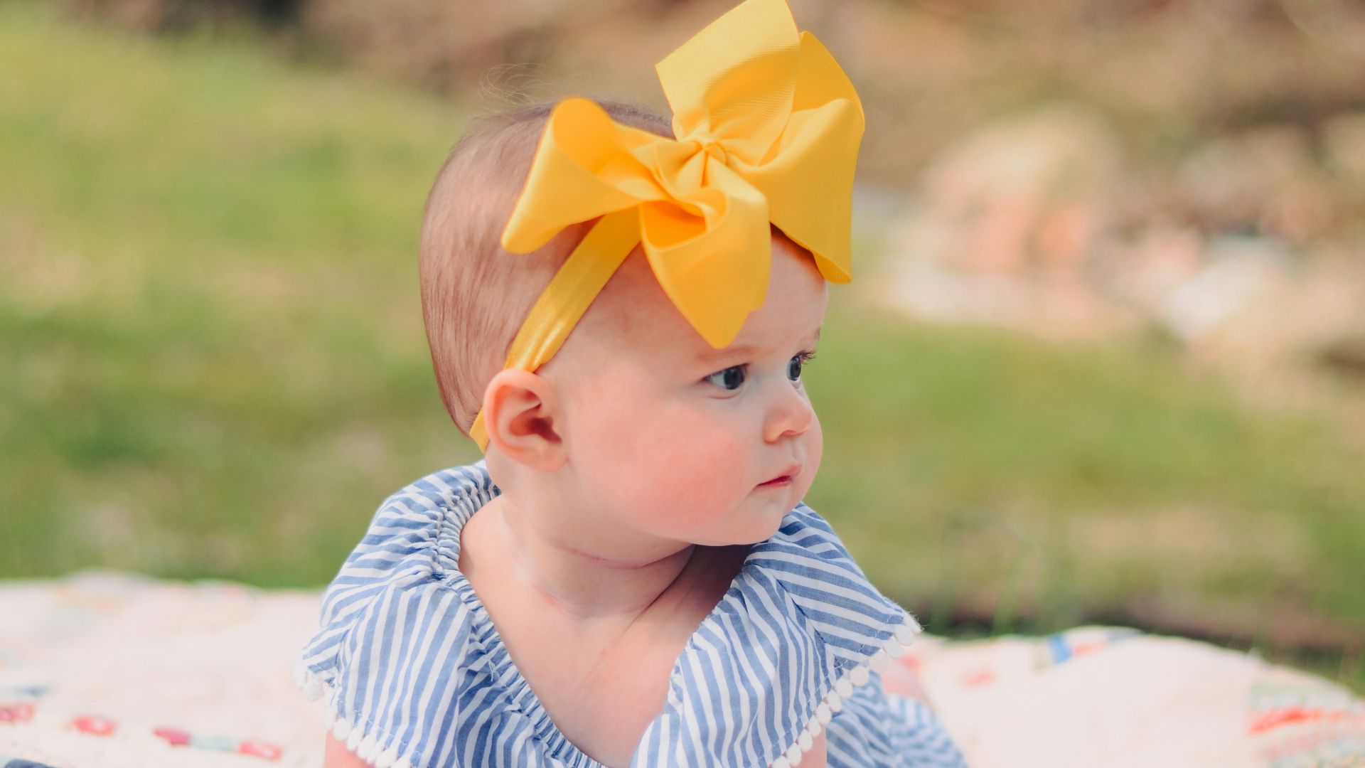 baby on mat in park during daytime