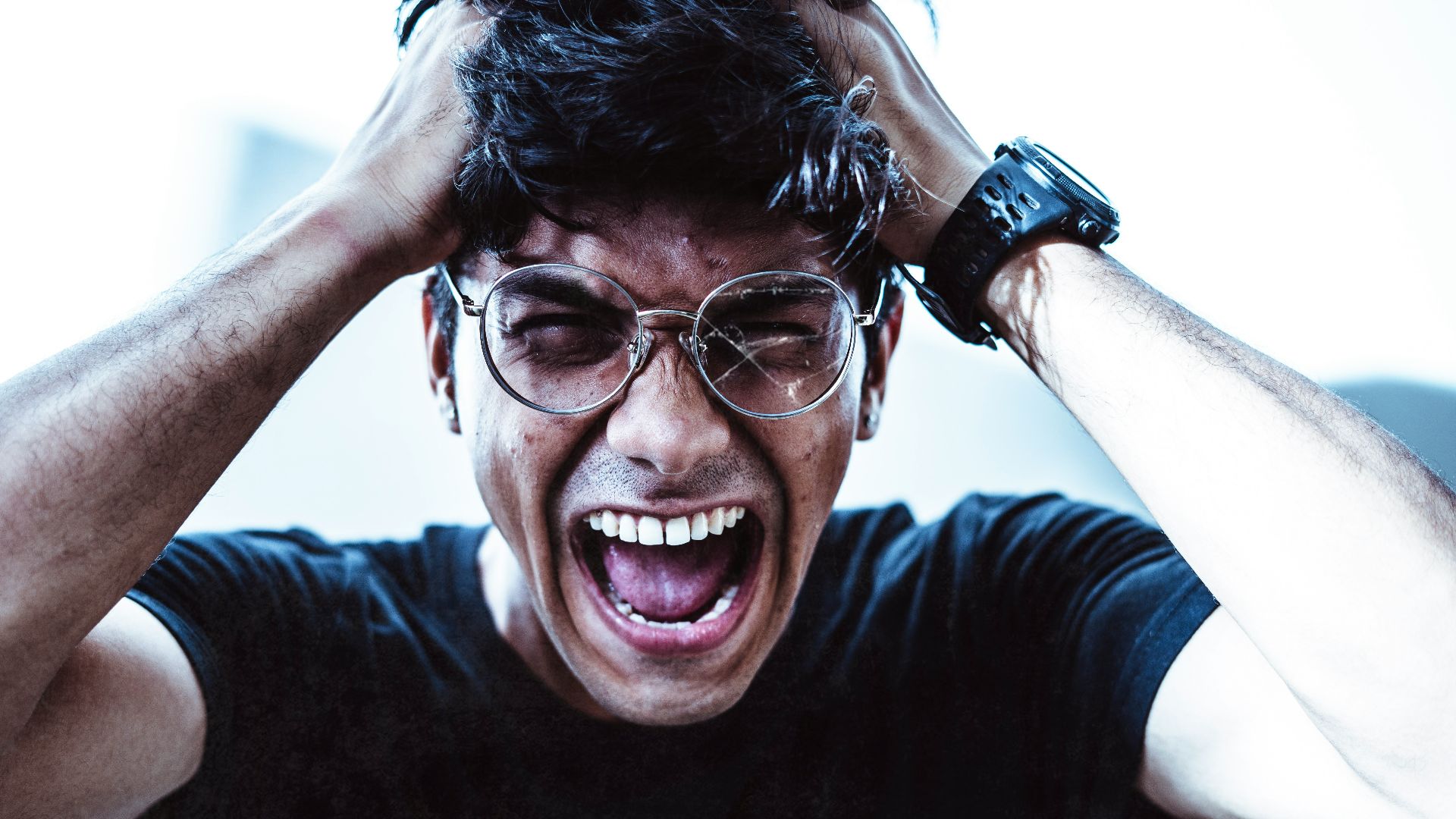 man in black crew neck t-shirt smiling