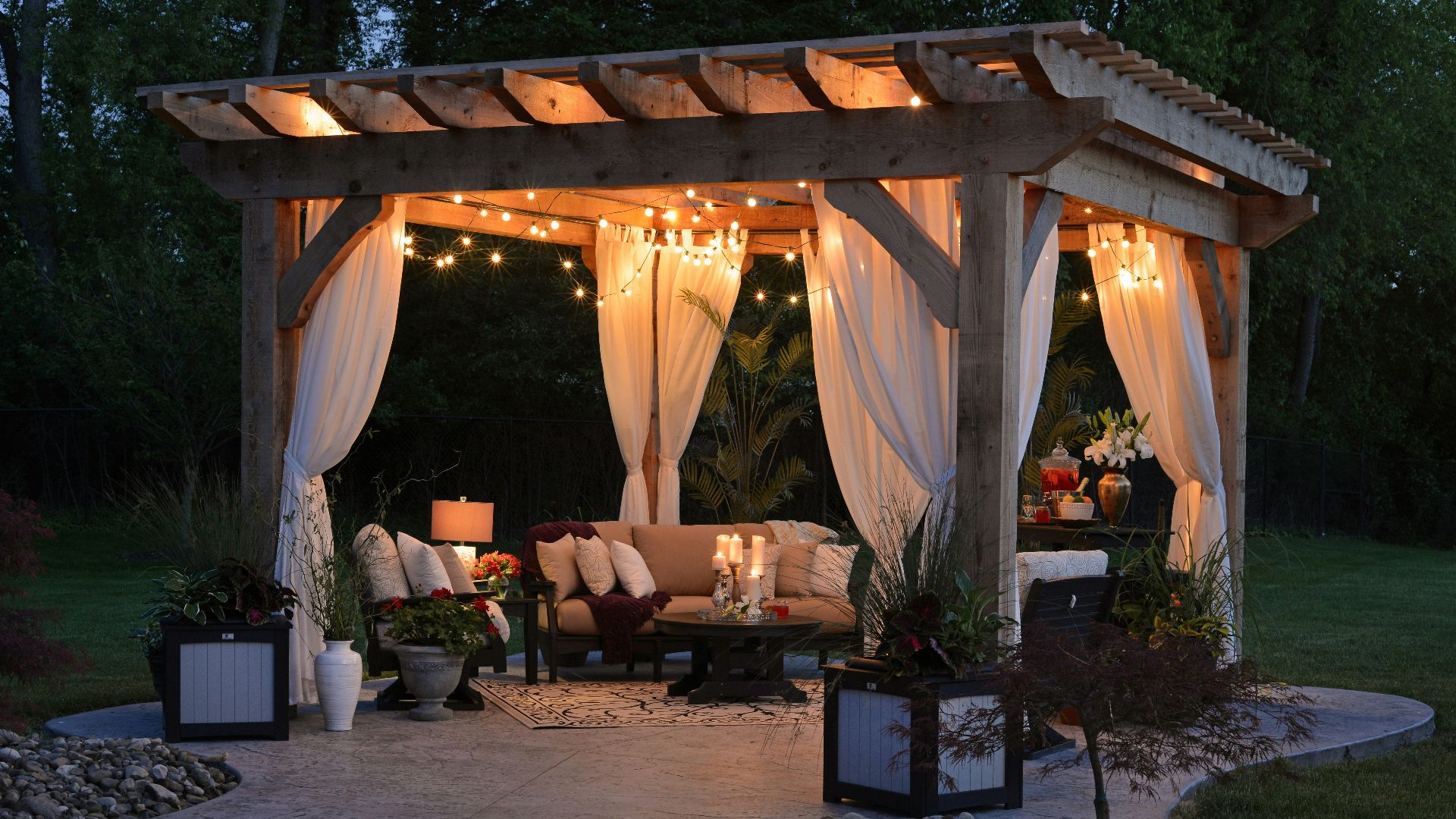 photo of gazebo with curtain and string lights