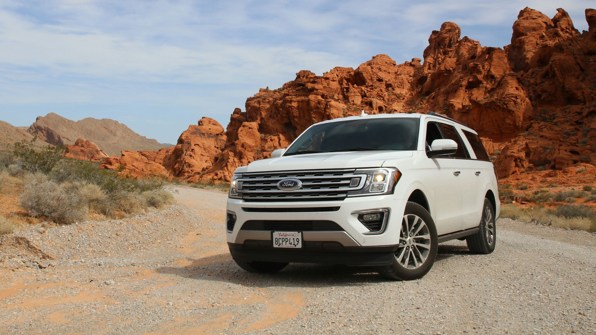 parked white Ford Explorer SUV