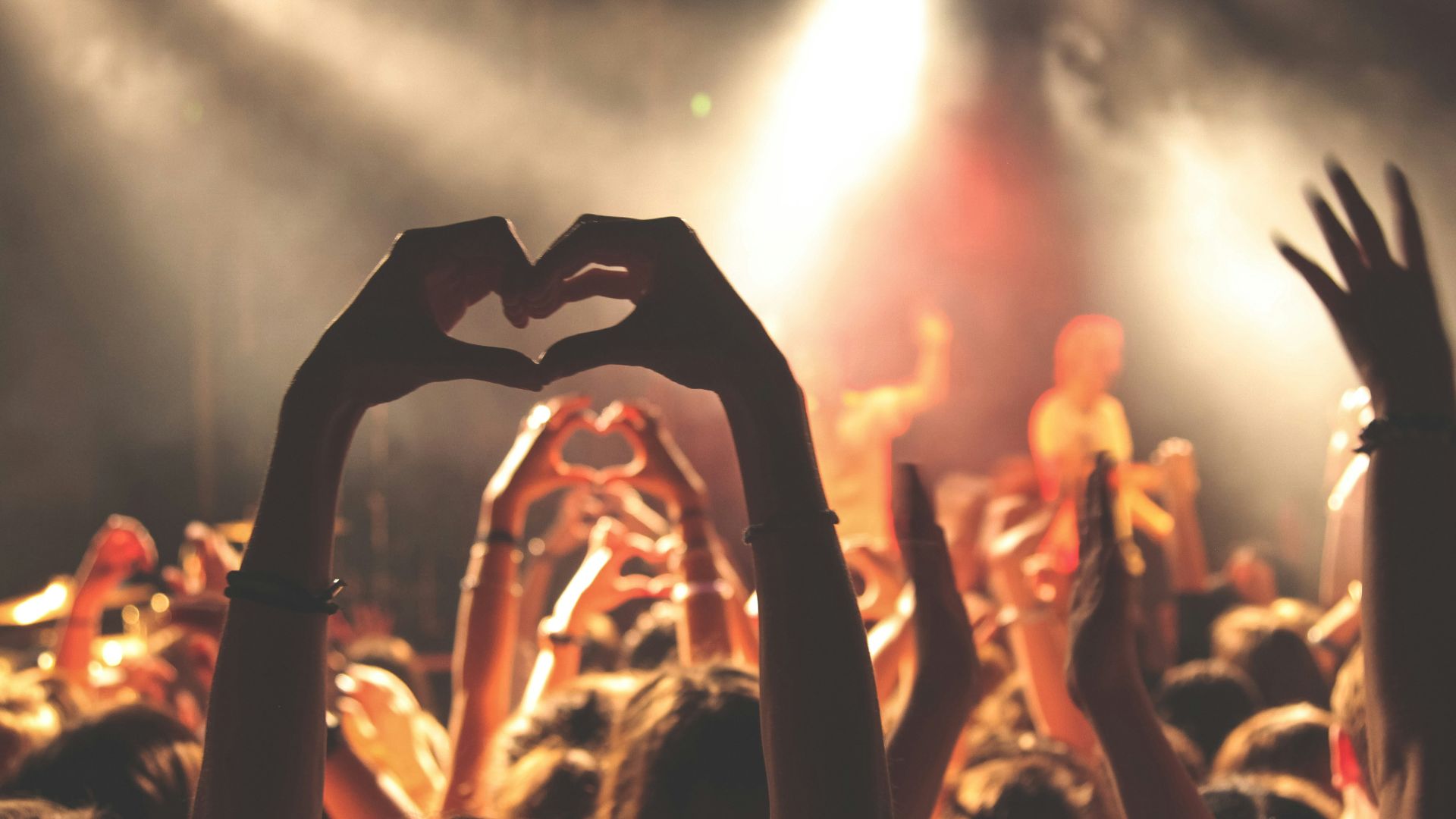 person performing heart hand gesture