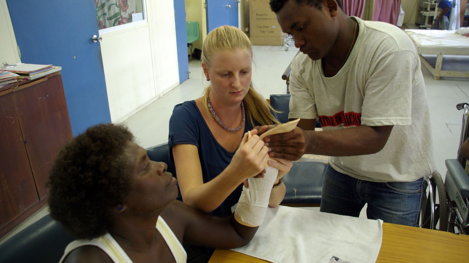 File:Occupational Therapist Melanie Glapa works with student George Hage to shape the hand splint for hand therapy patient ‘Pemoli’ at the physiotherapy ward at the National Referral Hospital, Honiara. (10711530113).jpg