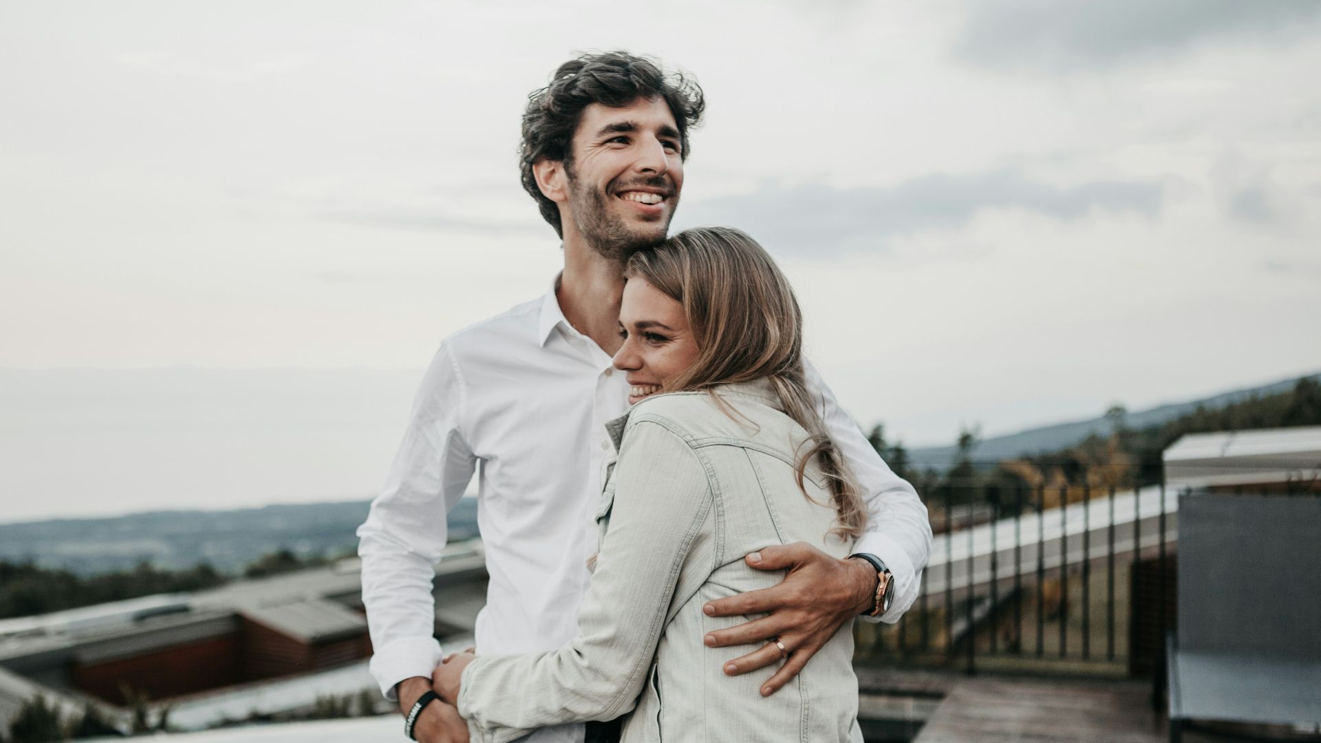 man and woman hugging each other