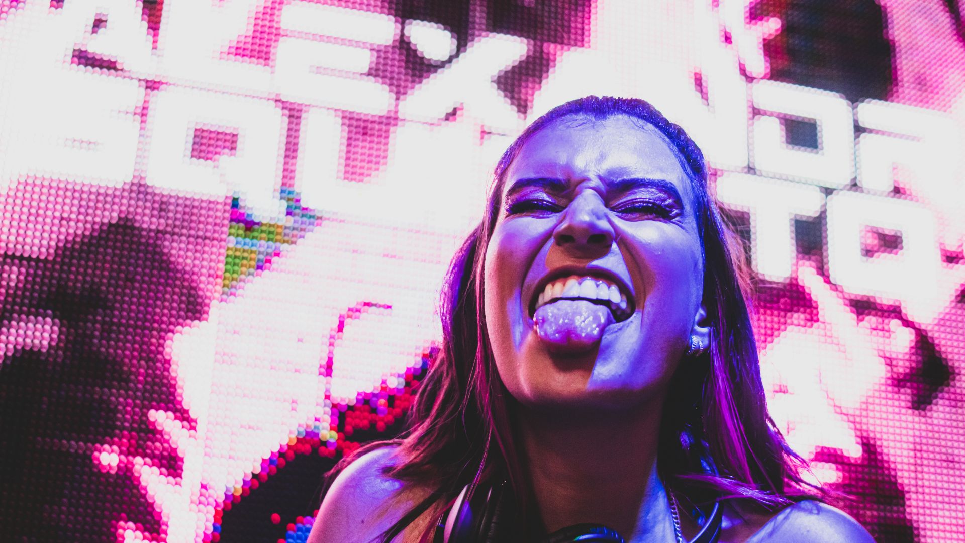 a woman with her mouth open and a tie around her neck