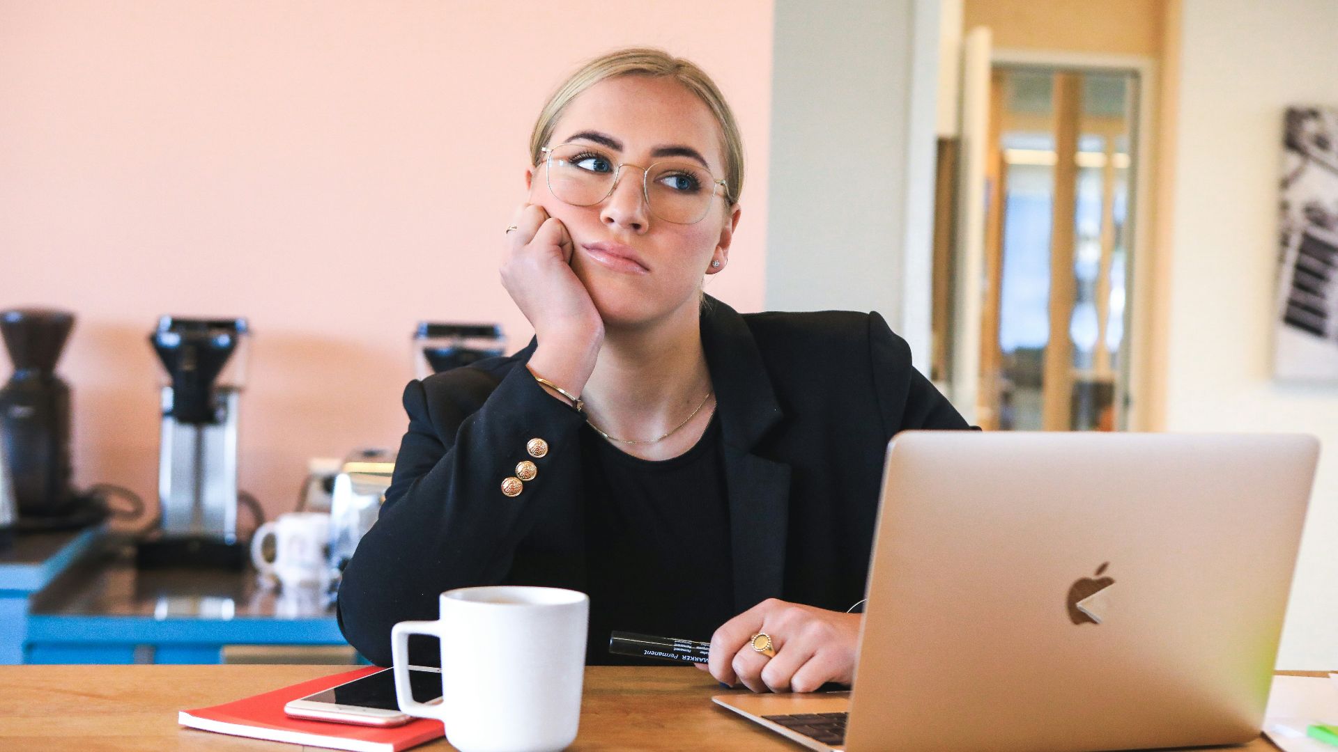 woman in black long sleeve shirt using macbook