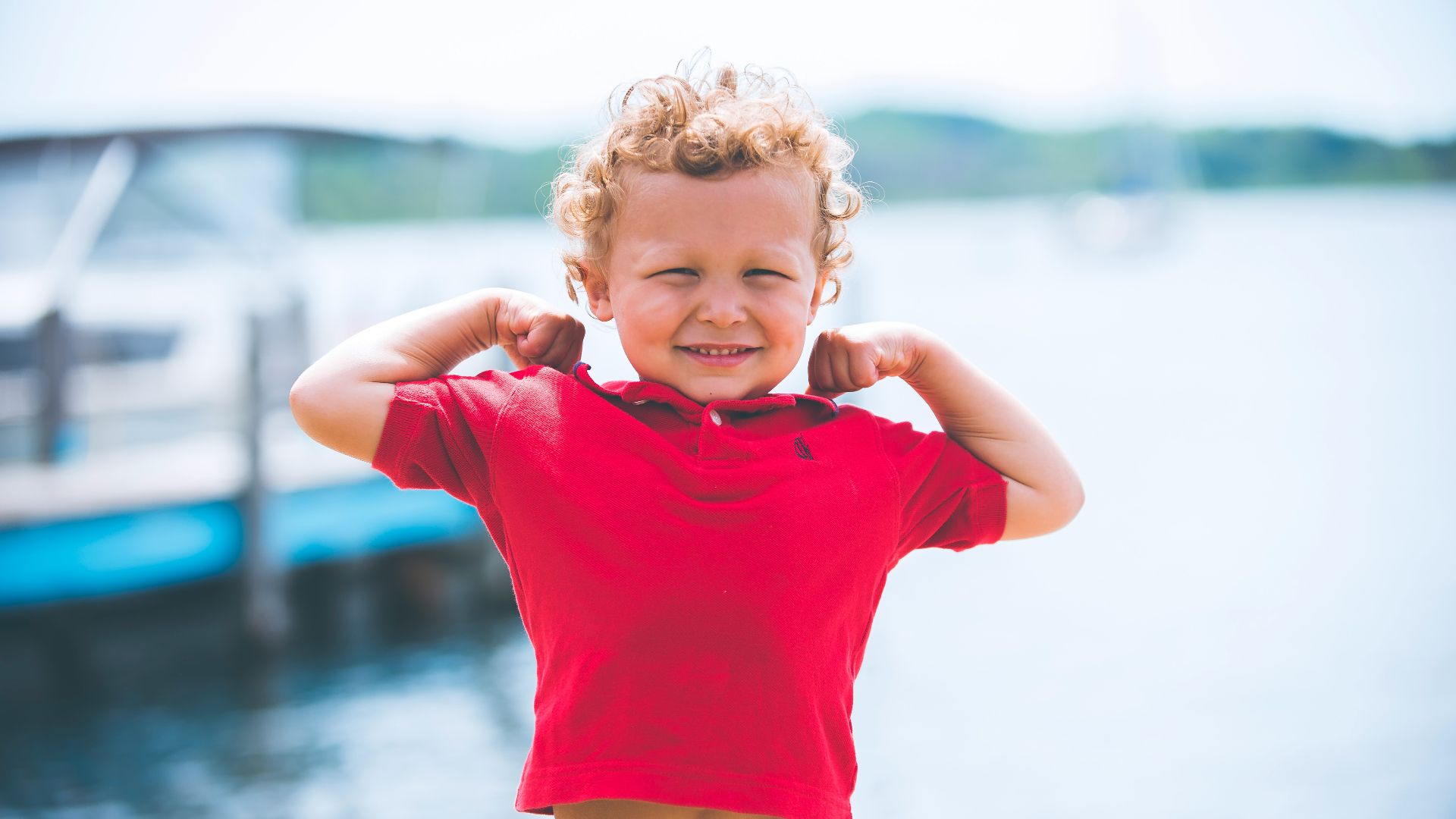 boy standing near dock