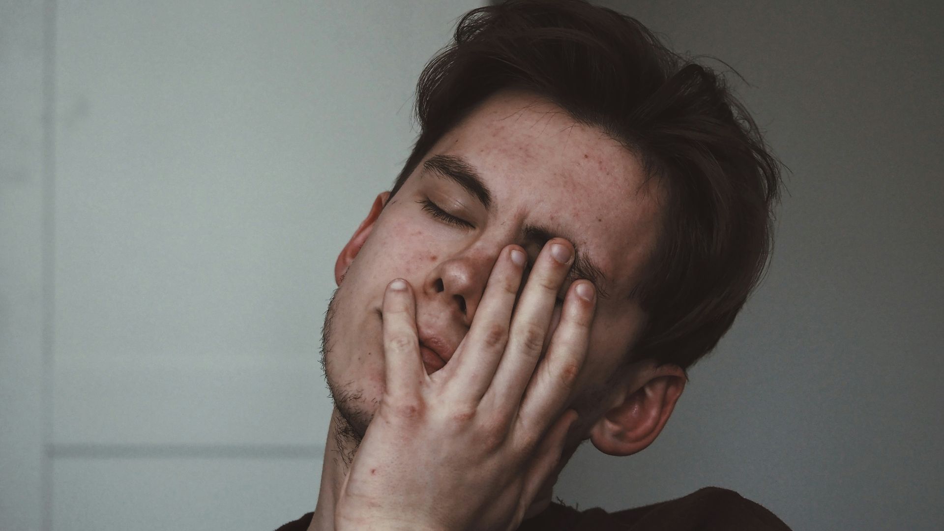 man wearing black crew-neck top