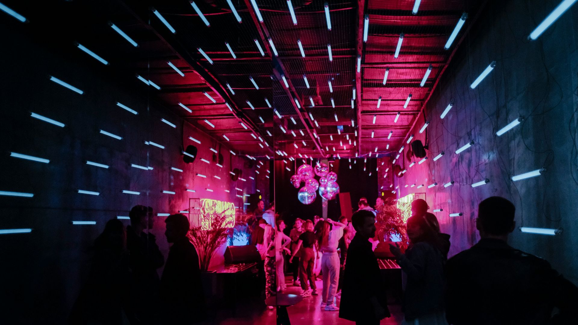 a group of people standing around in a room