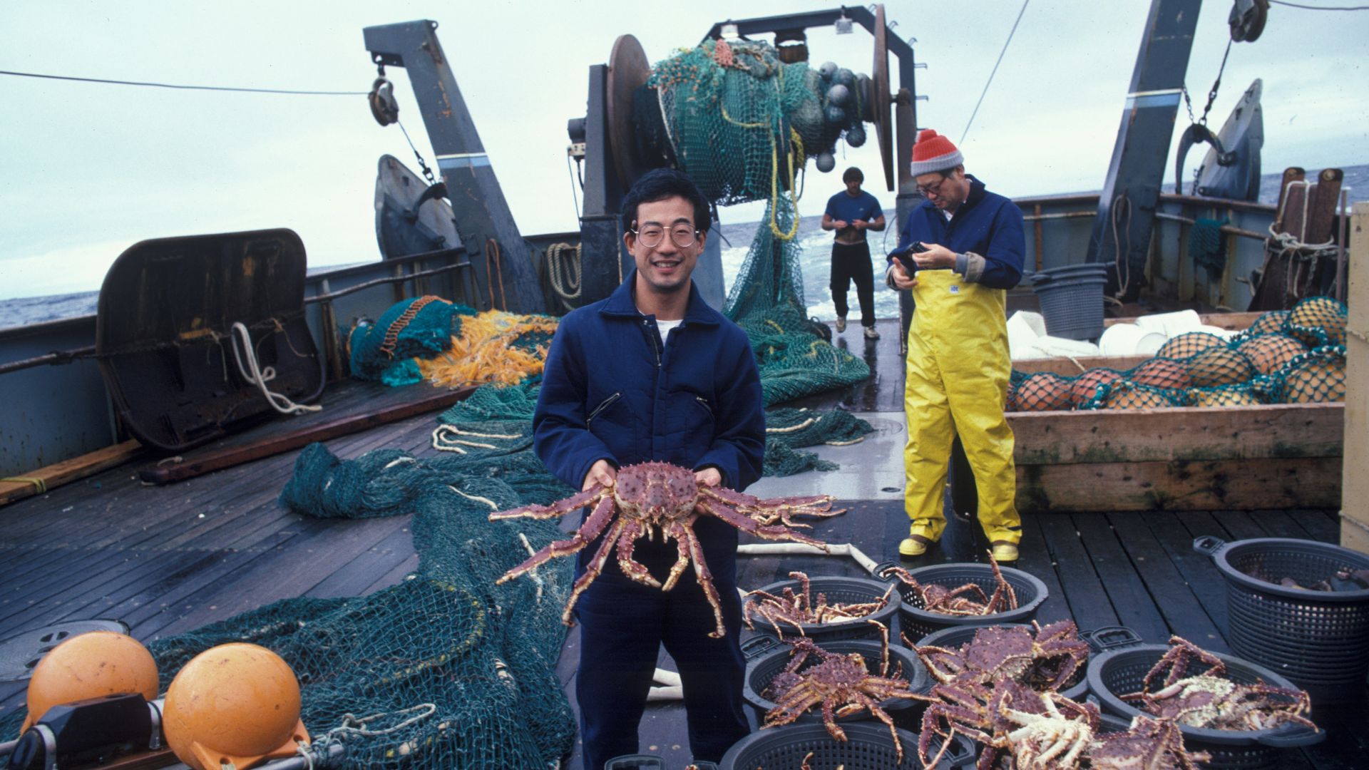 man holding brown crab