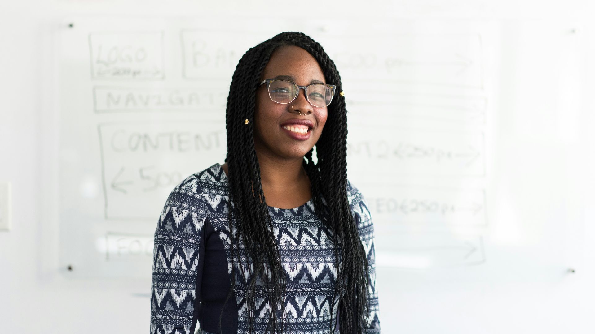 smiling woman wearing chevron top