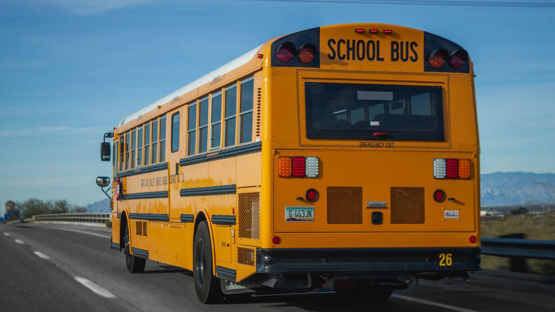 yellow school bus on road during daytime