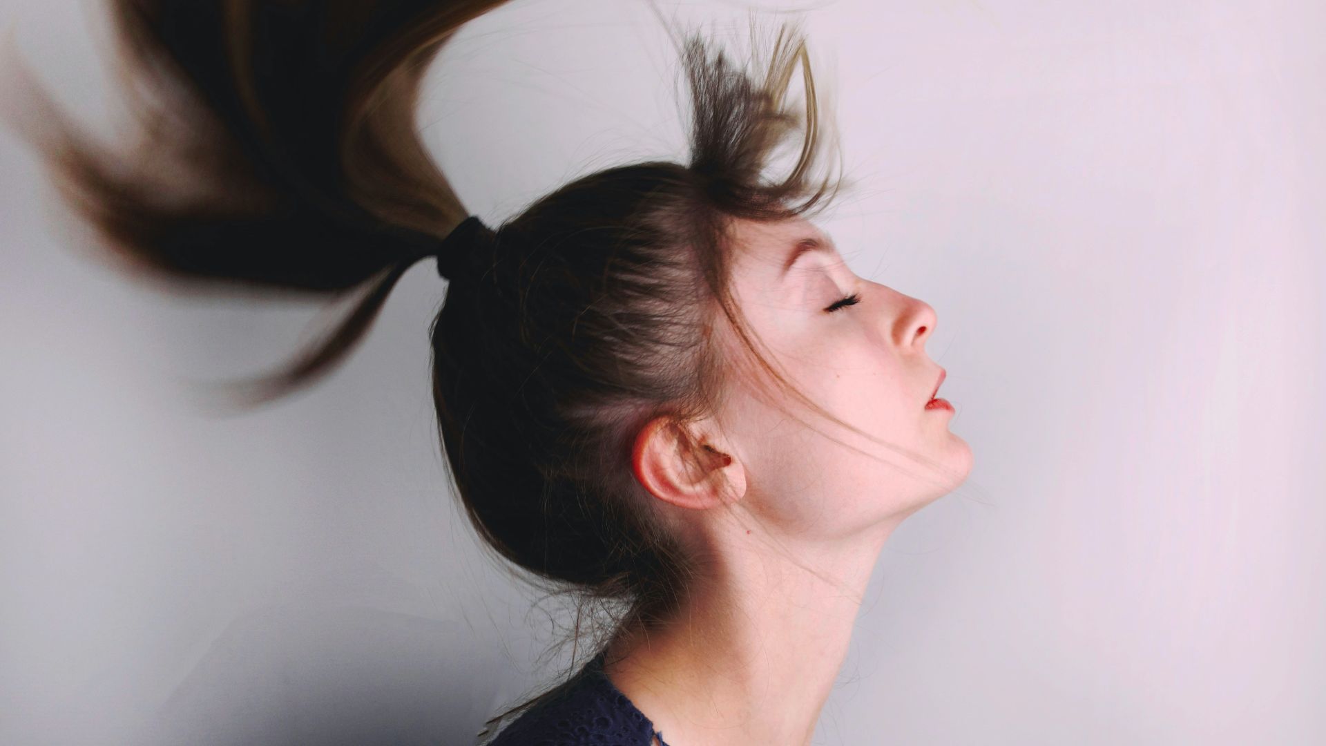 woman in black shirt with brown hair