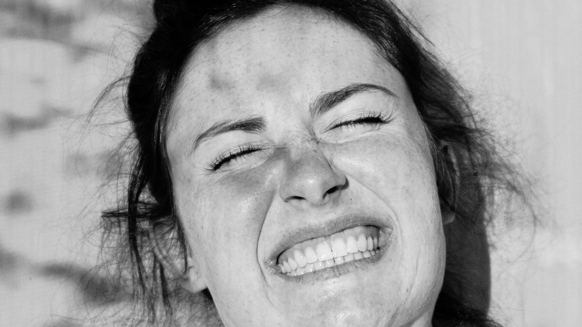 smiling woman in white crew neck shirt