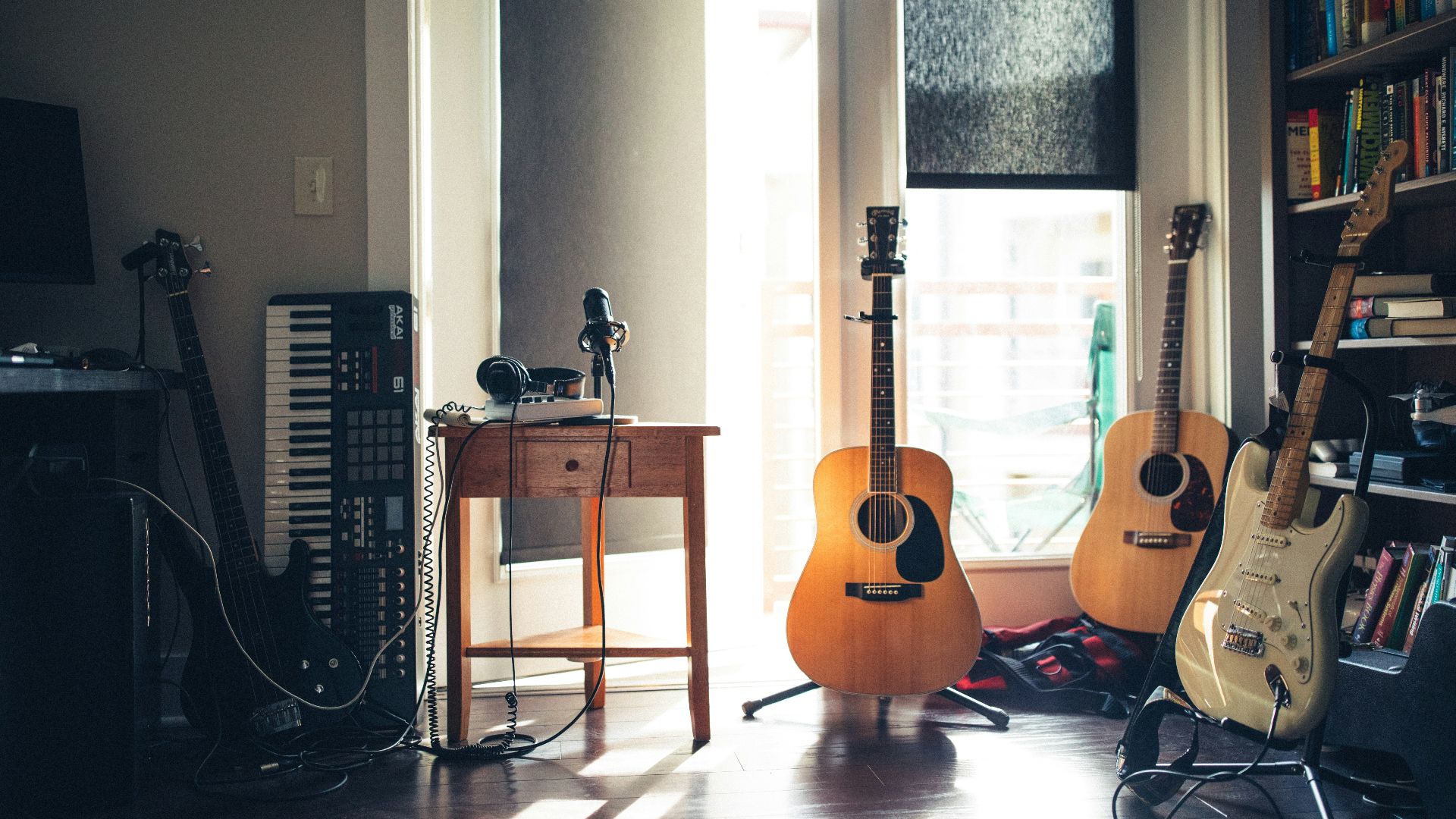 several guitars beside of side table
