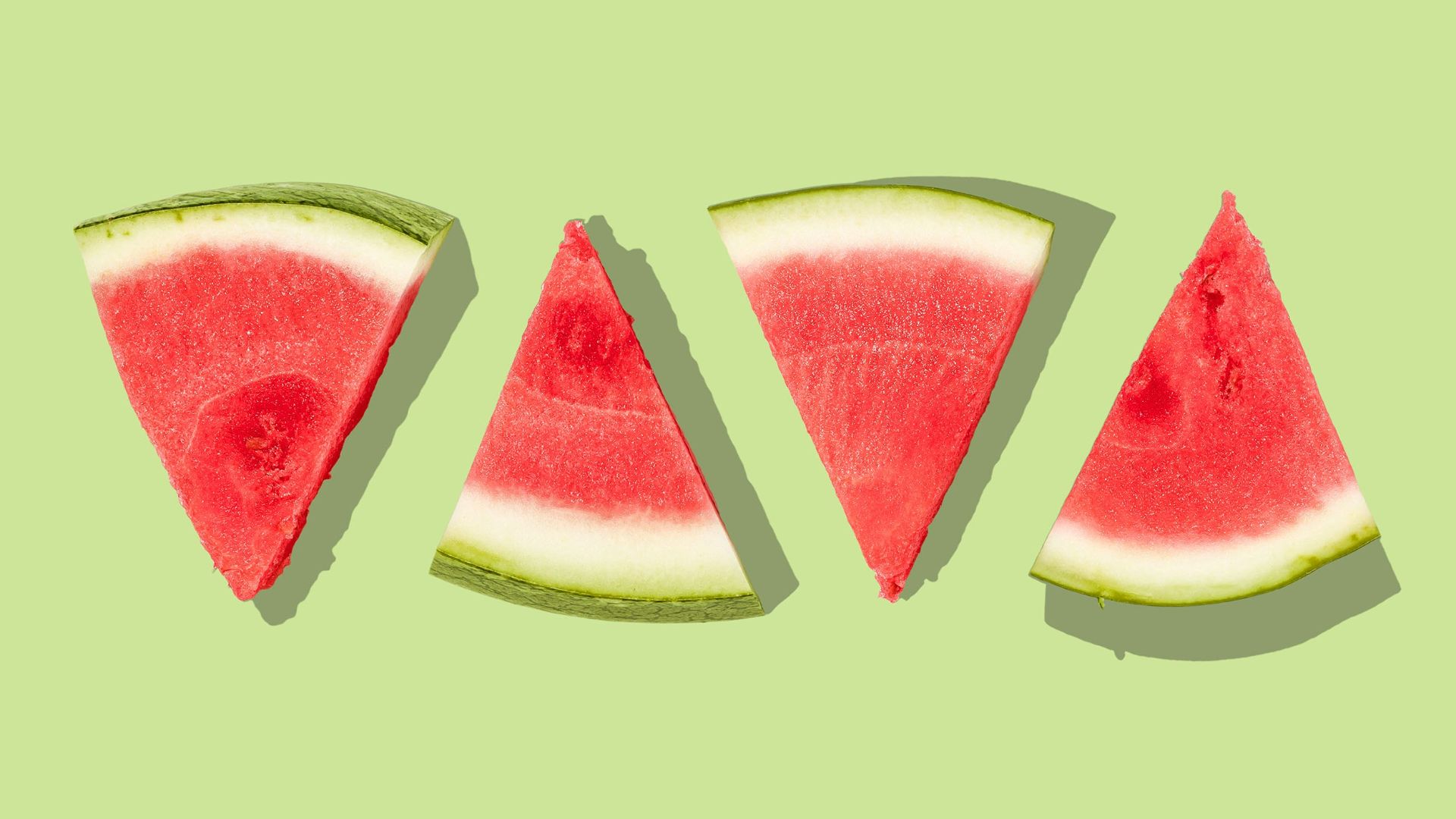 sliced watermelon with green background