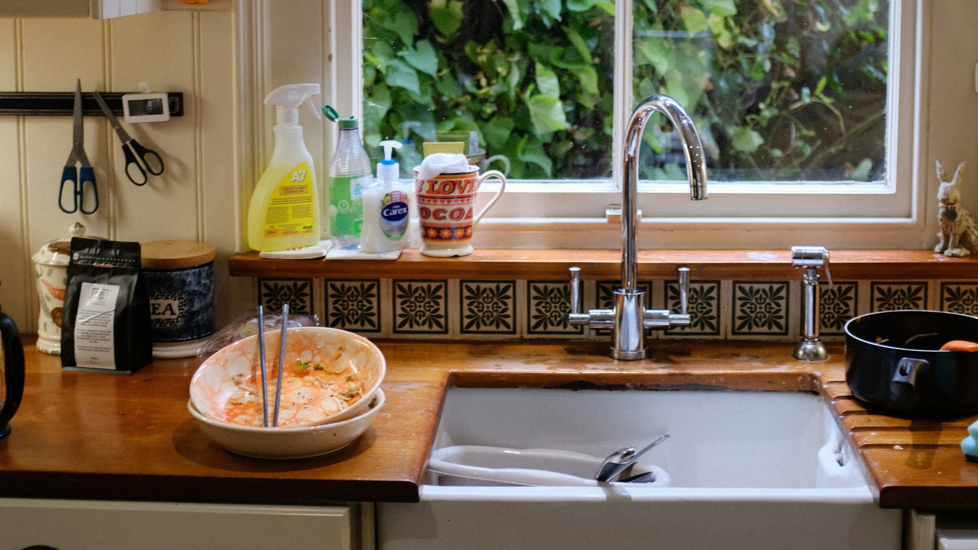 brown wooden round table with stainless steel faucet
