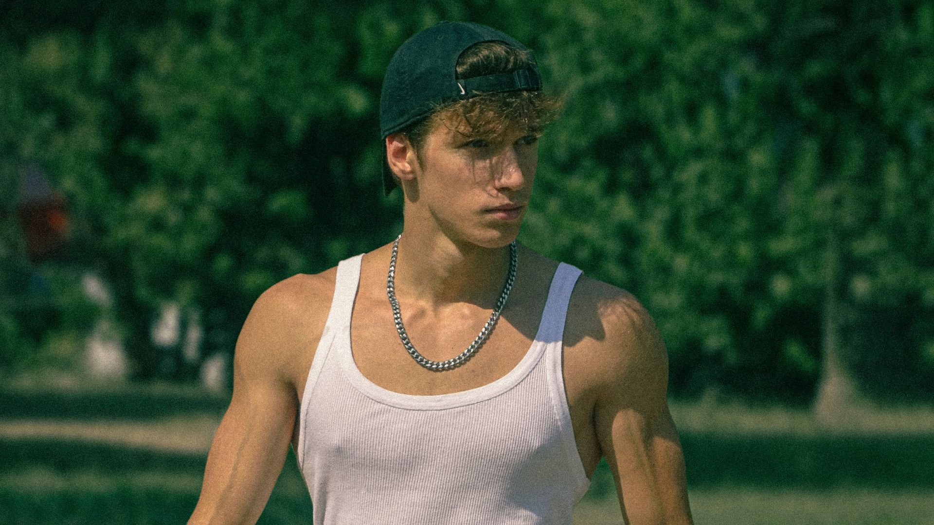 a person wearing a hat and shorts