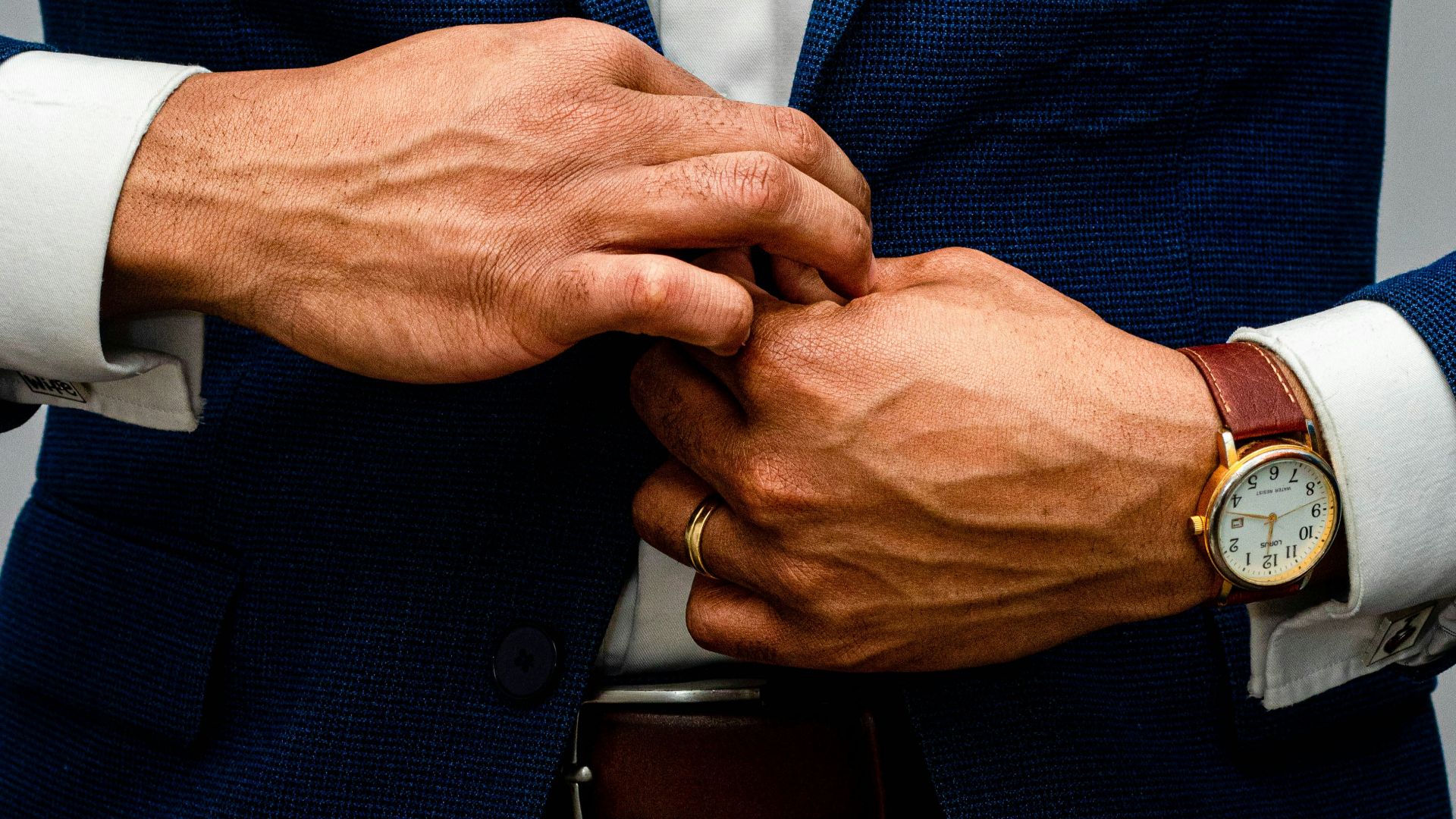 man in blue suit jacket and white dress shirt