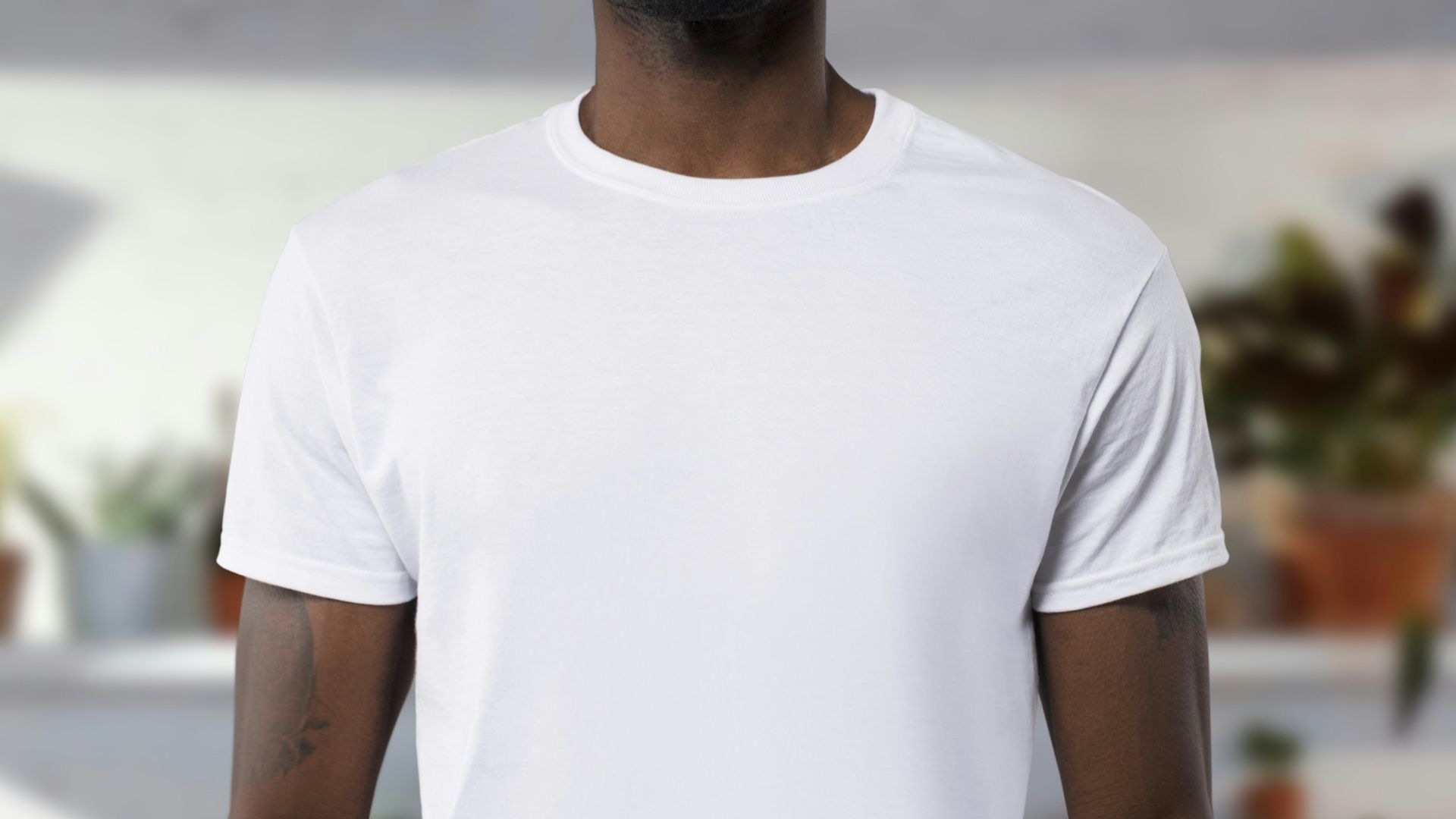 man wearing white crew-neck t-shirts