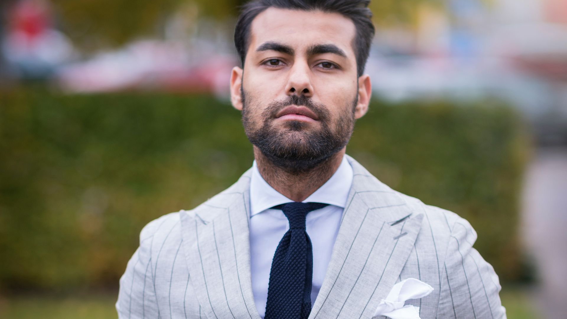 man in white and black pinstripe suit jacket