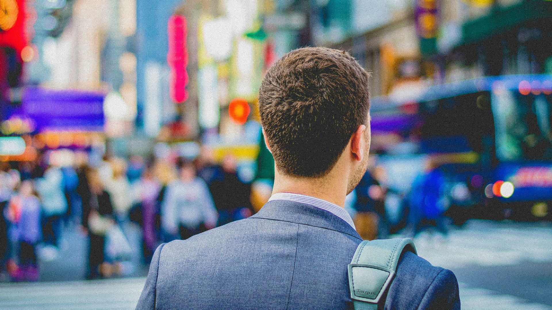 shallow focus photography of man in suit jacket's back