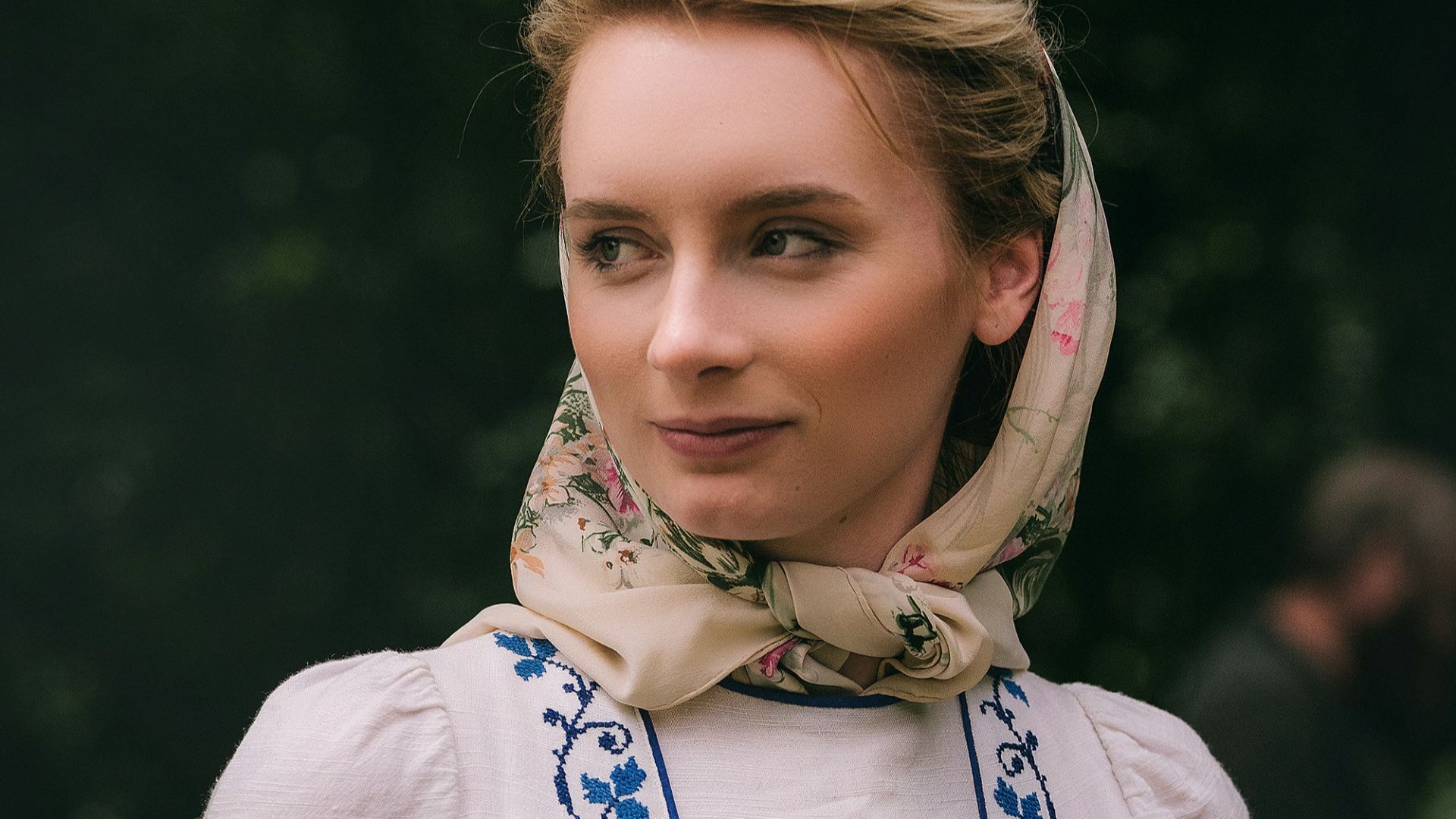 selective focus photography of woman holding long wallet