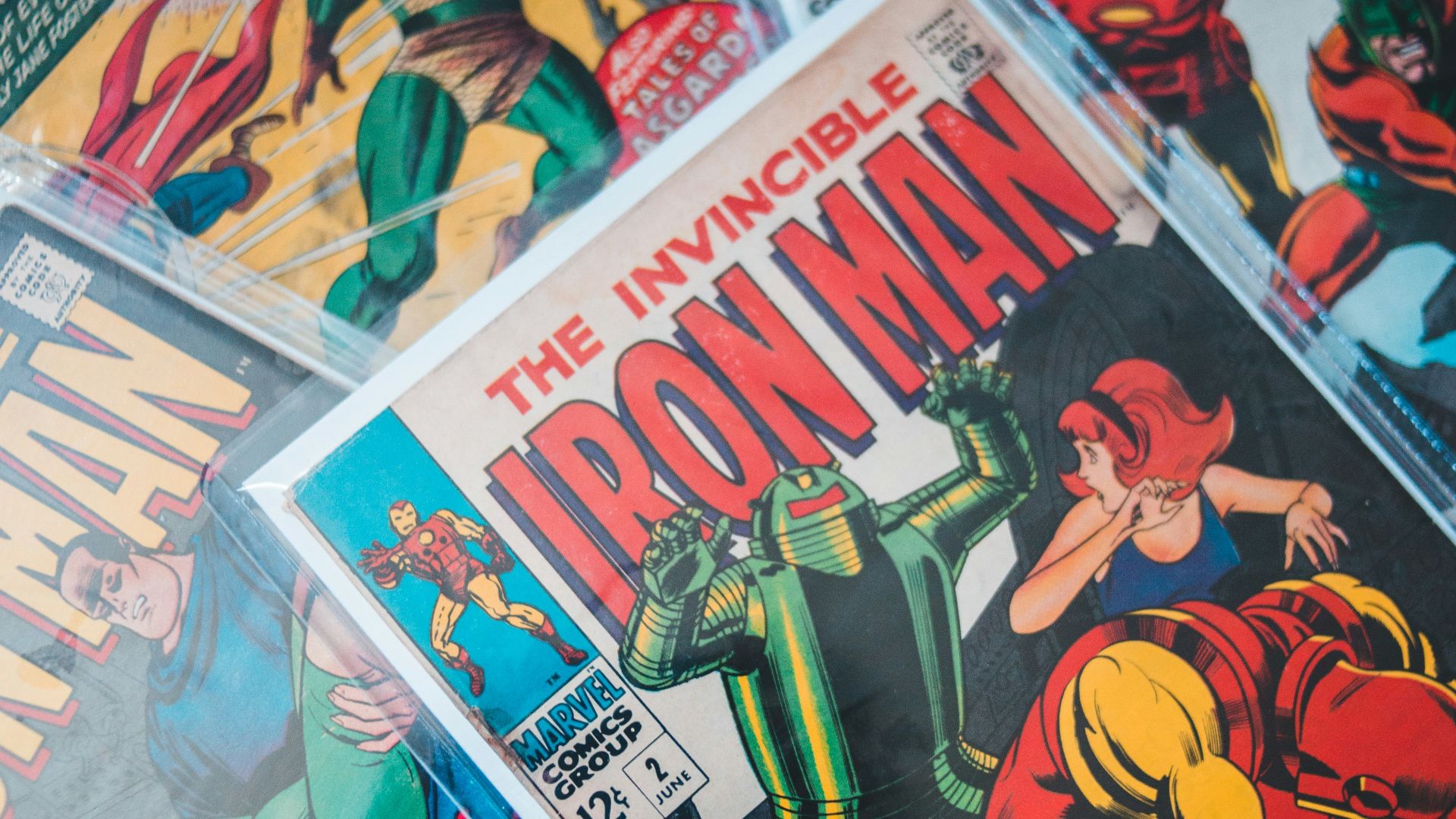 a pile of comics sitting on top of a table