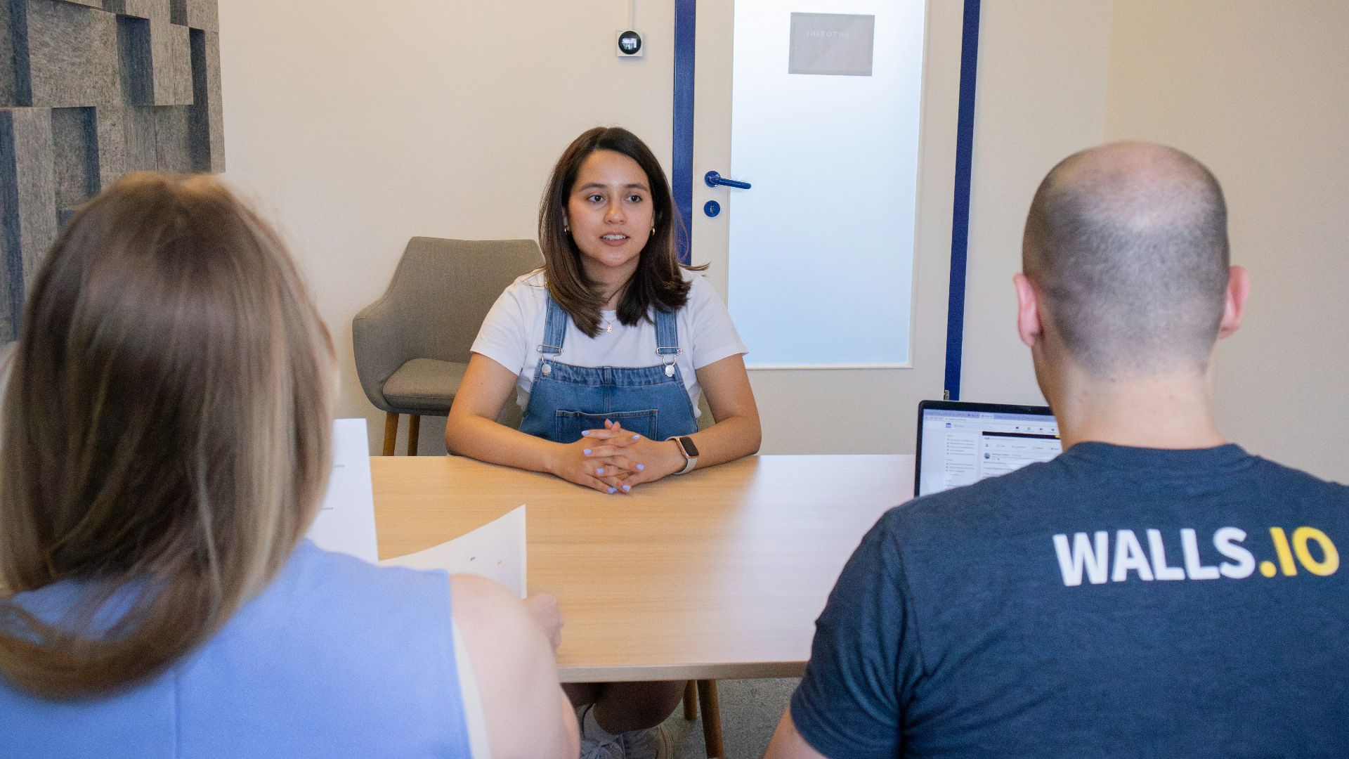 a group of people sitting around a table