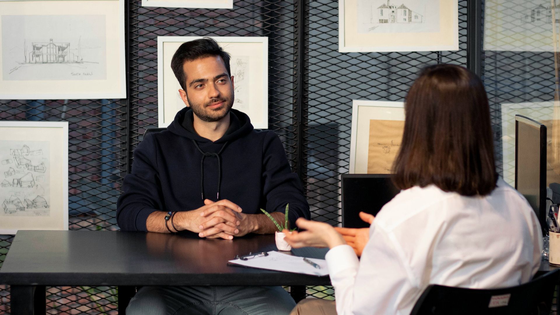 a man and a woman sitting at a table