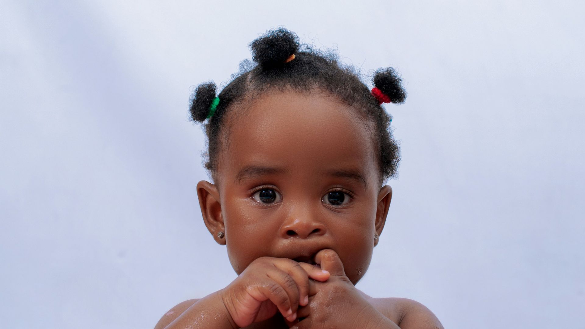 a baby with a flower crown