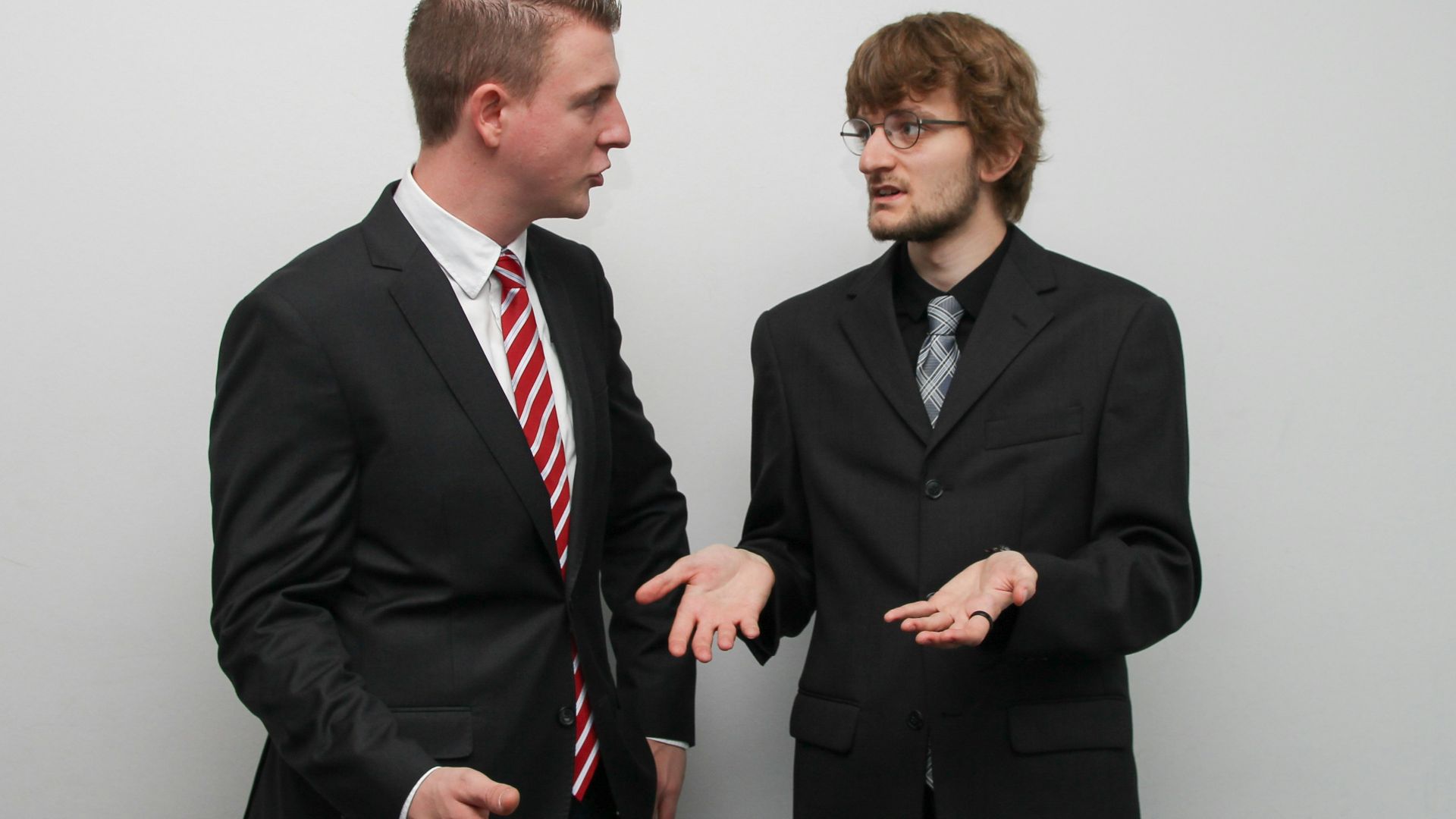 man wearing black suit jacket
