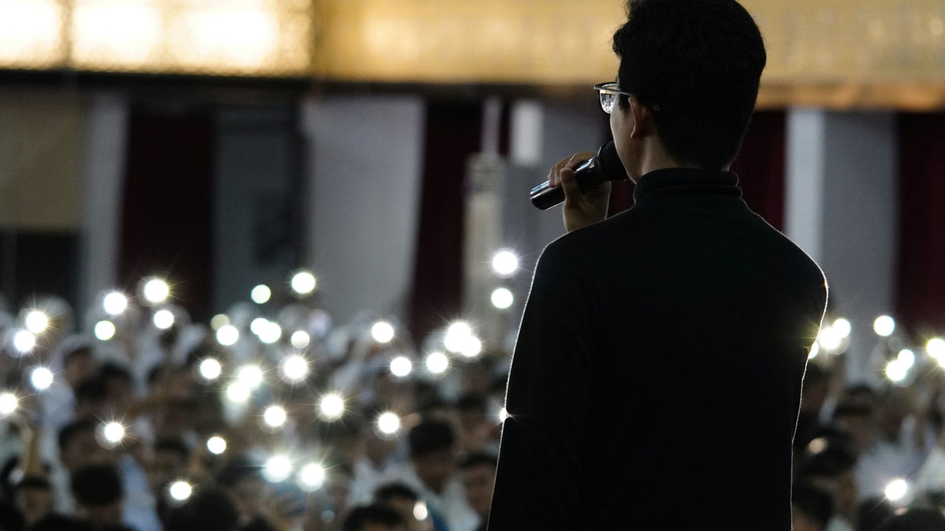 a man standing in front of a crowd of people