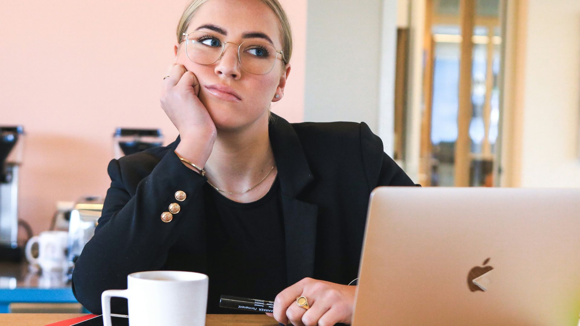 woman in black long sleeve shirt using macbook